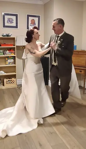 Bride Wearing Classic Simple Wedding Dress Called Mitchell By Maggie Sottero Dancing With Groom