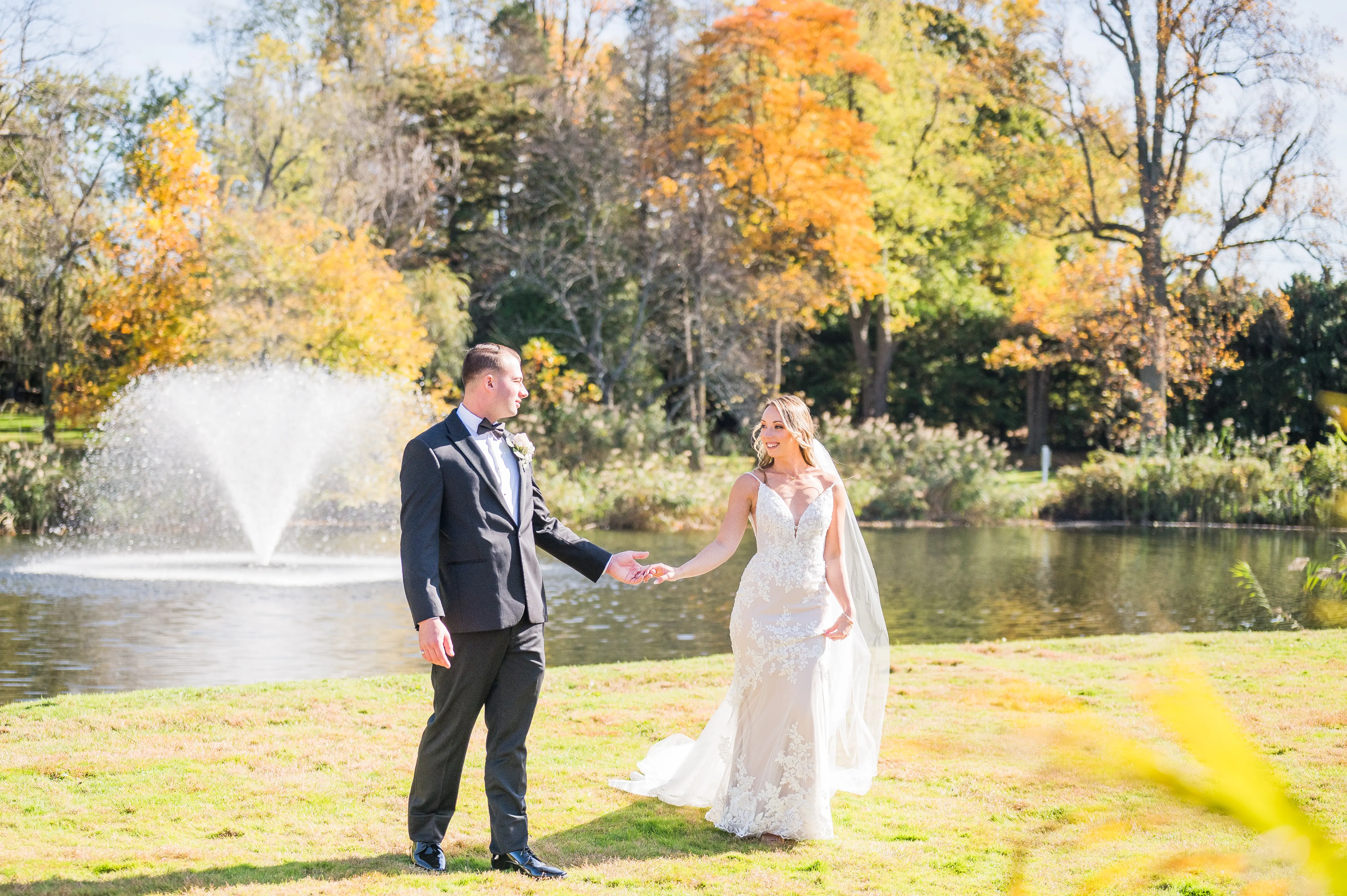 Real bride in sparkly lace fit-and-flare bridal gown with lace motifs over tulle called Fontaine by Maggie Sottero