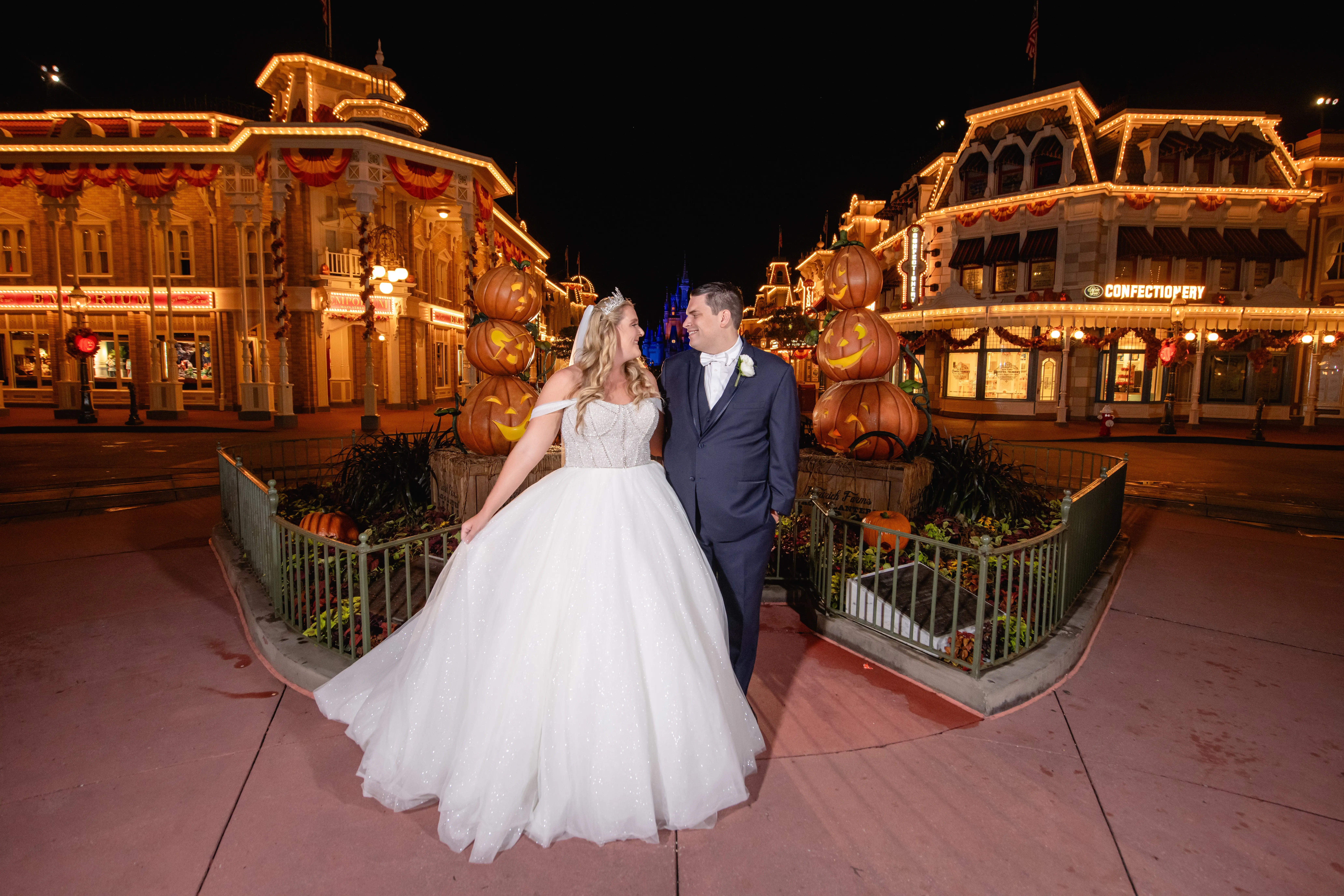 Bride wearing Elton wedding dress by Sottero and Midgley with her husband