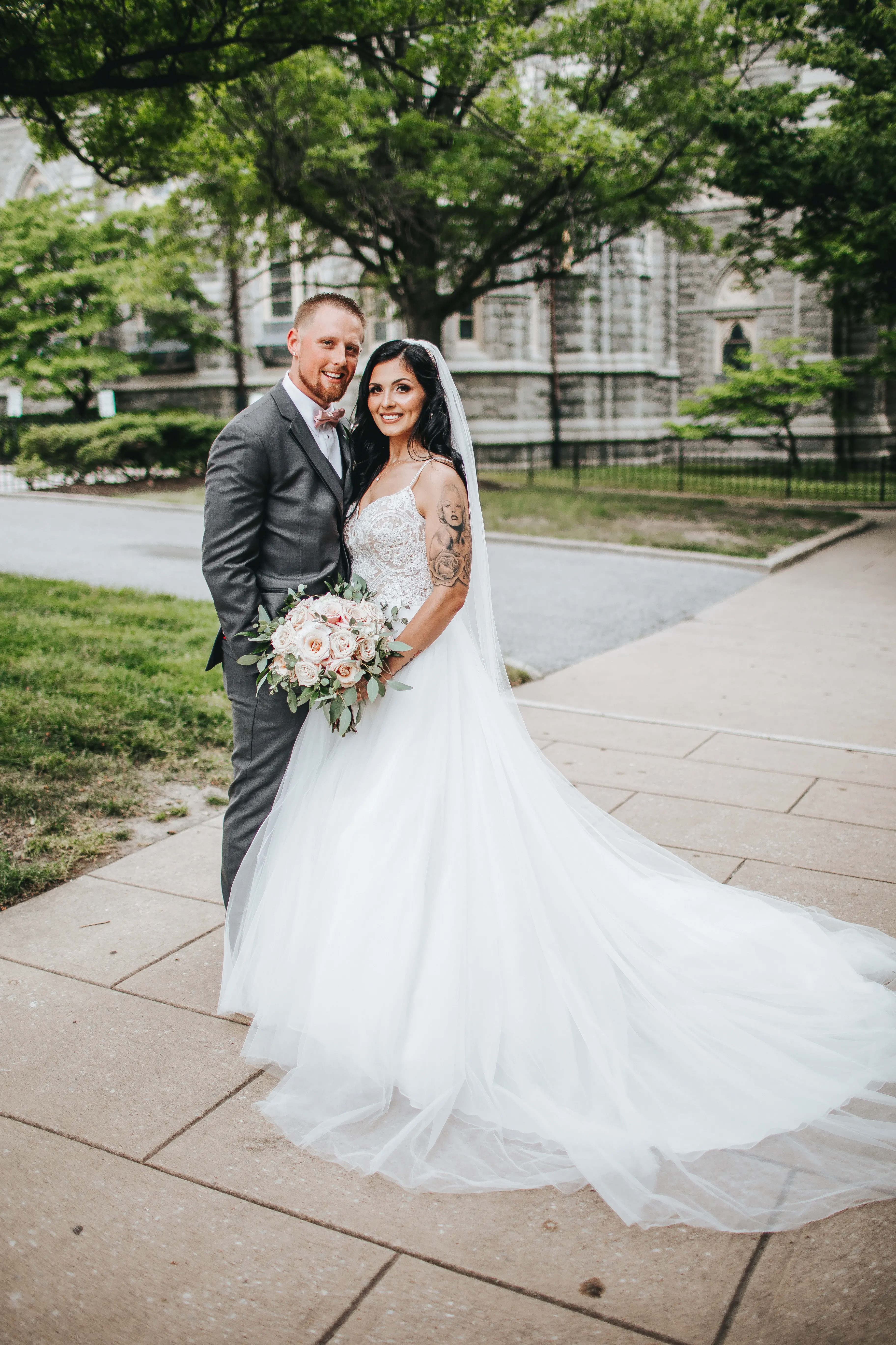 Bride with groom wearing boho princess wedding dress