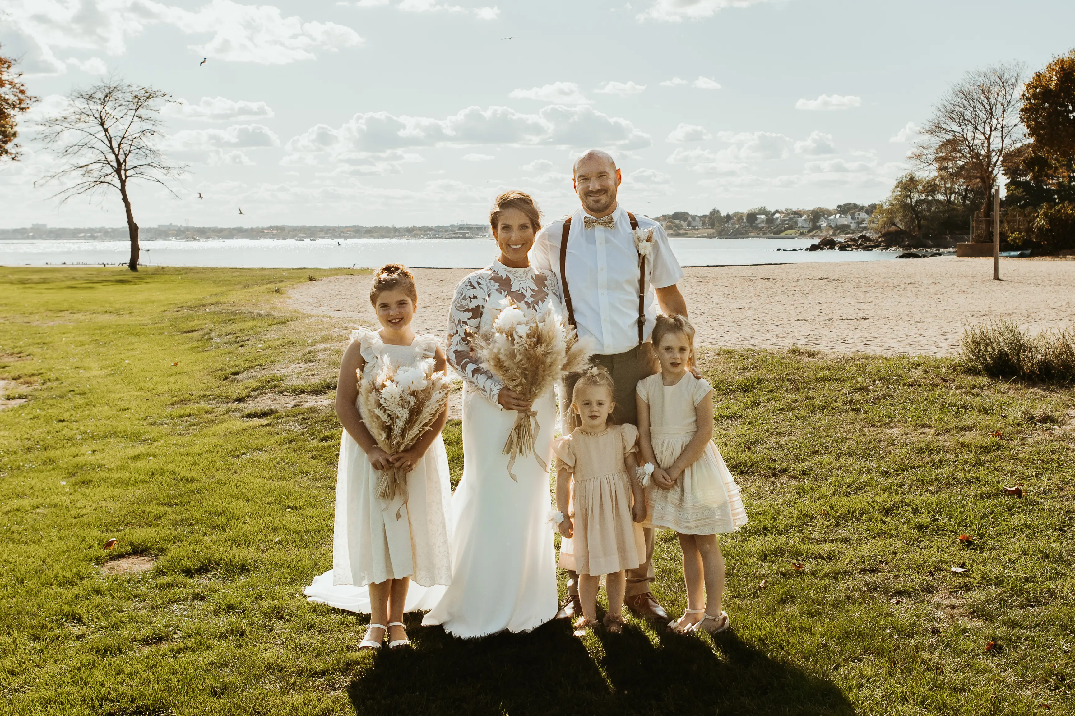 Bride Wearing Crepe Wedding Dress Called Dionne By Rebecca Ingram With Her Family On The Beach