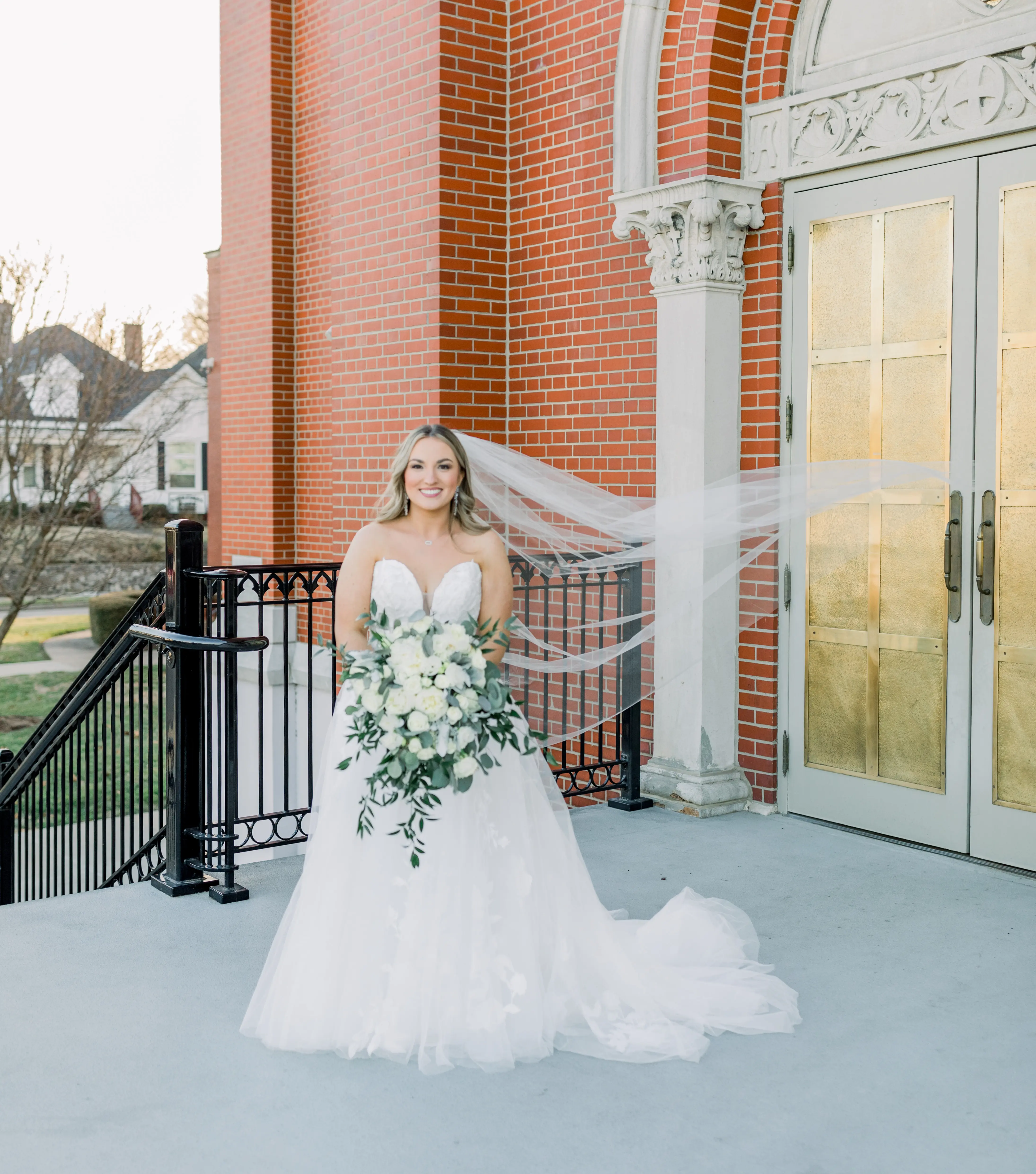 Bride wearing Hattie Lane Marie wedding dress by Rebecca Ingram