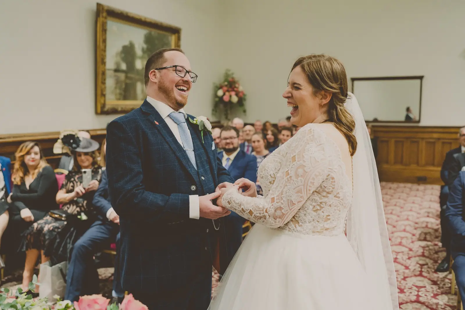 Bride Wearing Dreamy Long Sleeve Ballgown Wedding Dress Called Mallory Dawn By Maggie Sottero Exchanging Rings With Groom