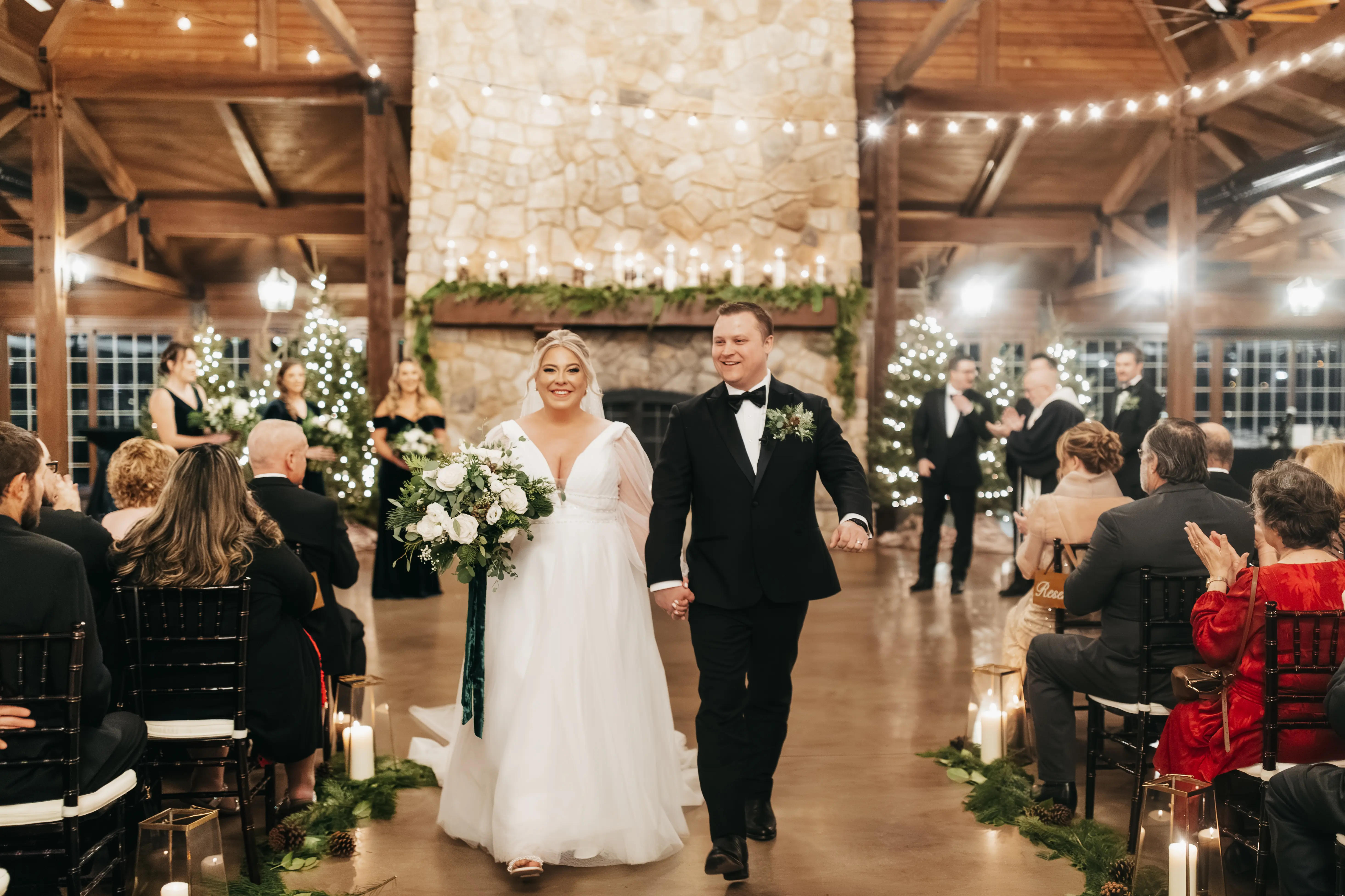 Bride wearing Joanne wedding dress by Rebecca Ingram walking down the aisle with her husband