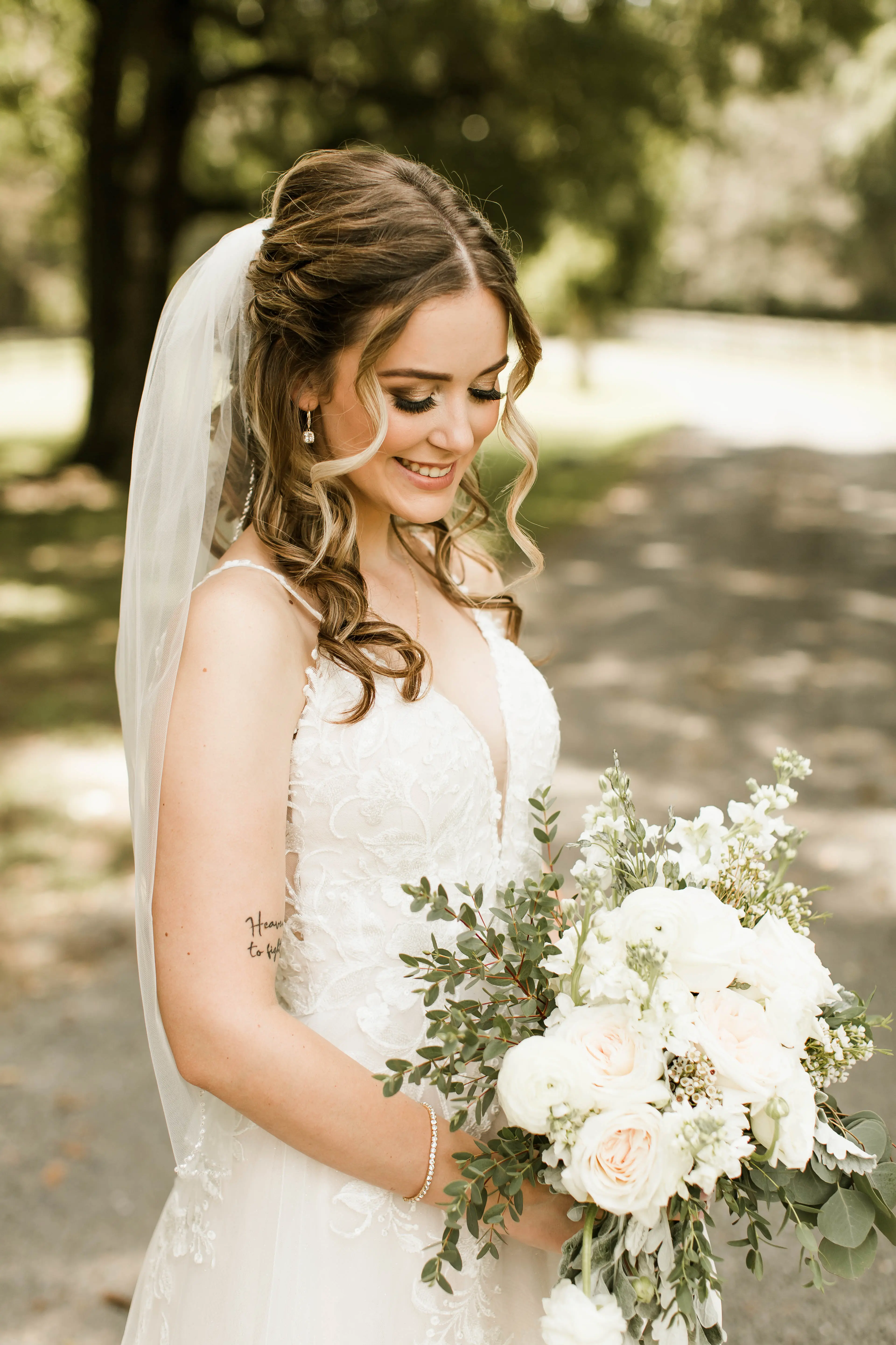 Bride wearing affordable floral ballgown wedding dress.