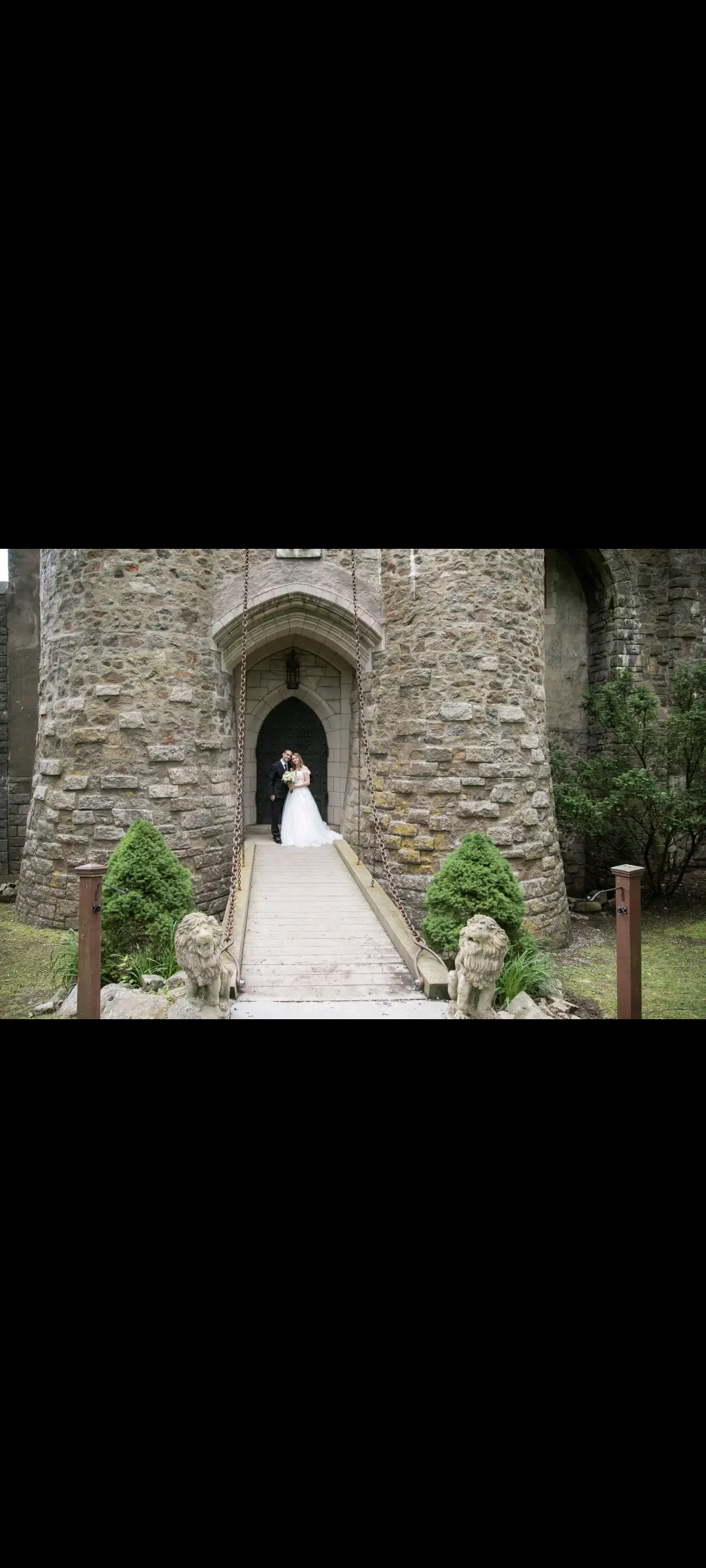 Bride wearing Harlem wedding dress by Maggie Sottero with her husband at their venue