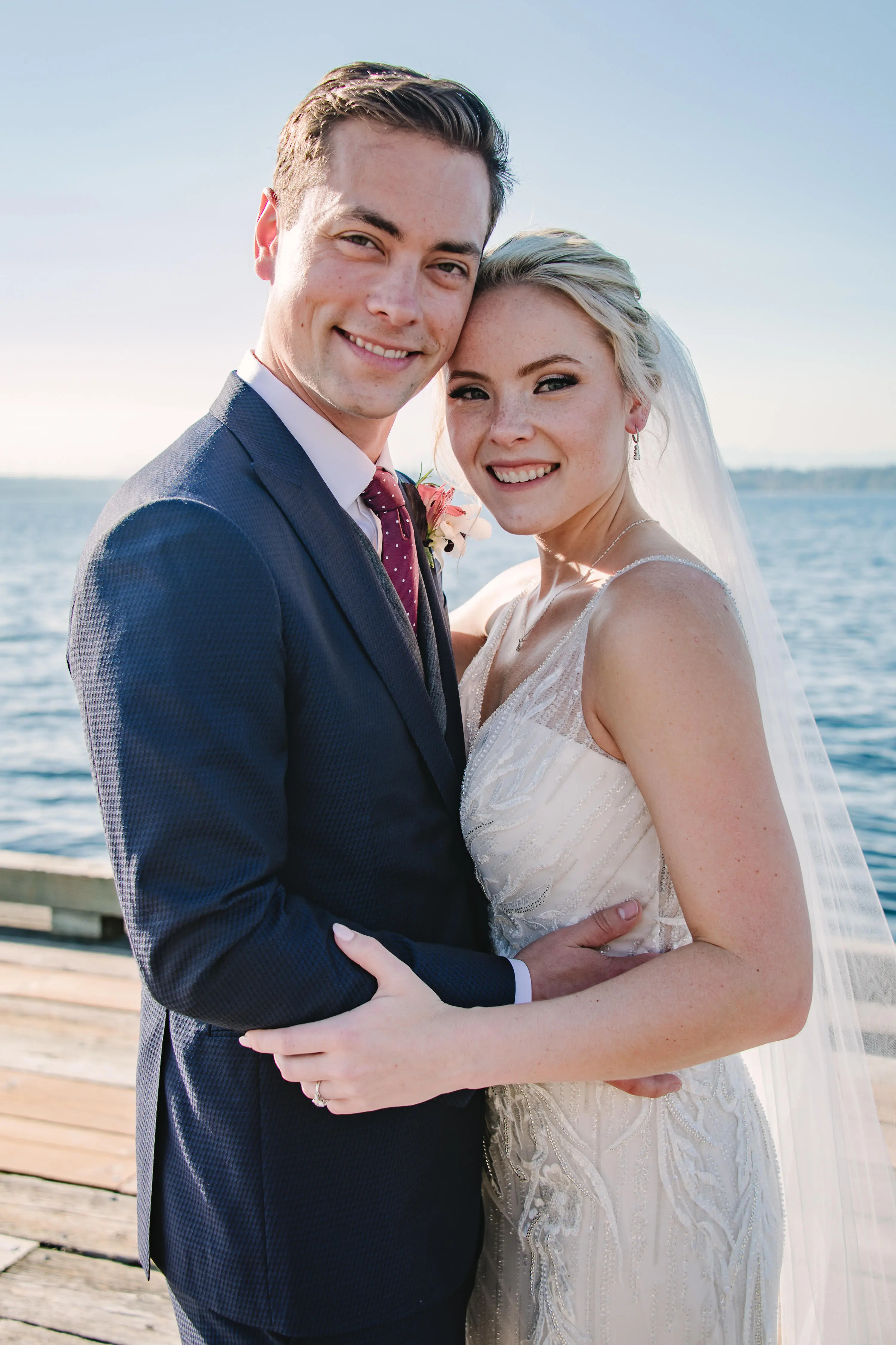 Bride Wearing Beaded Wedding Dress Called Luella By Sottero And Midgley With Groom With The Ocean Behind Them