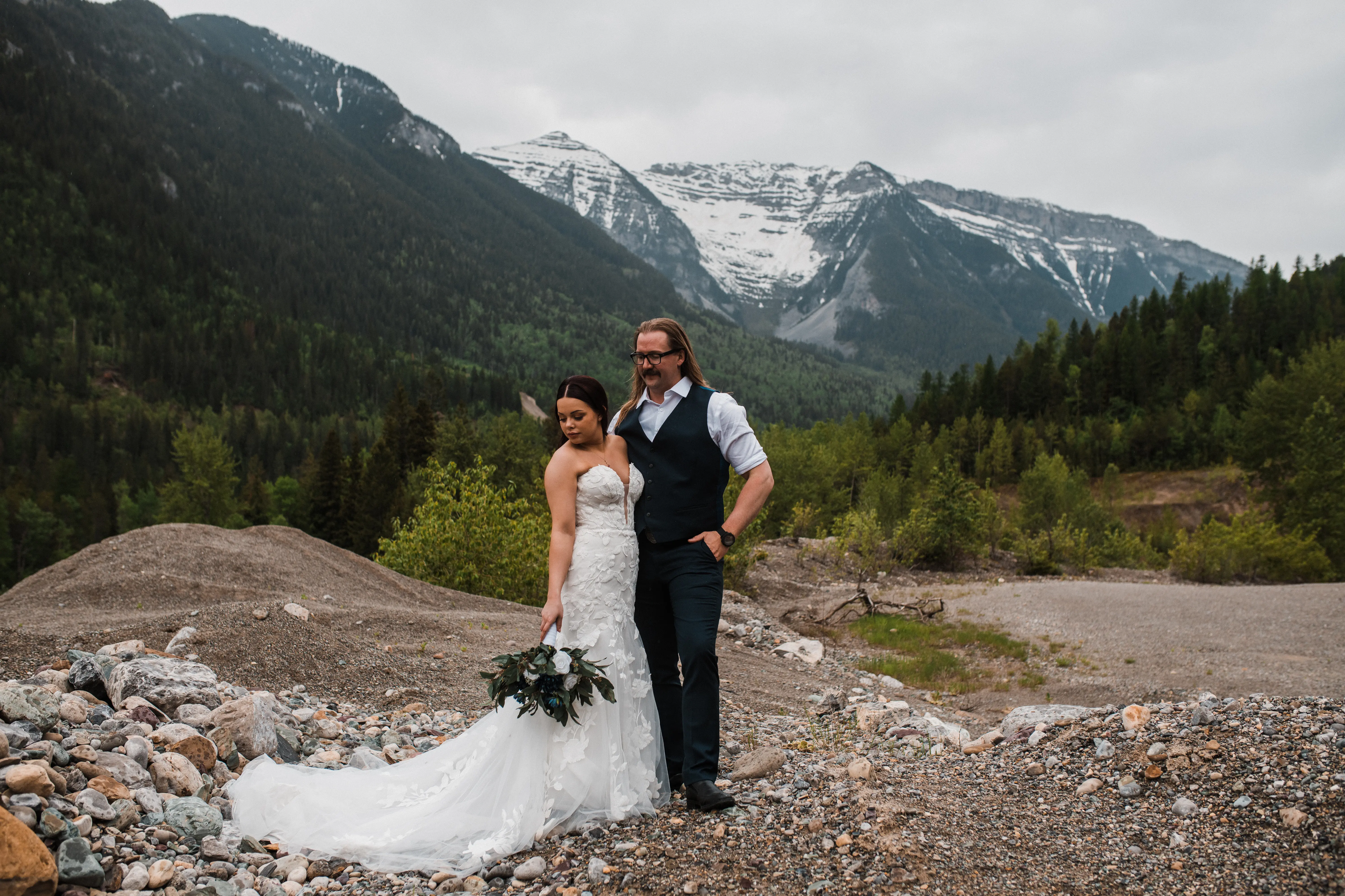 Groom Posing With Bride In Mermaid Wedding Dress With Large Floral Lace Called Hattie By Rebecca Ingram
