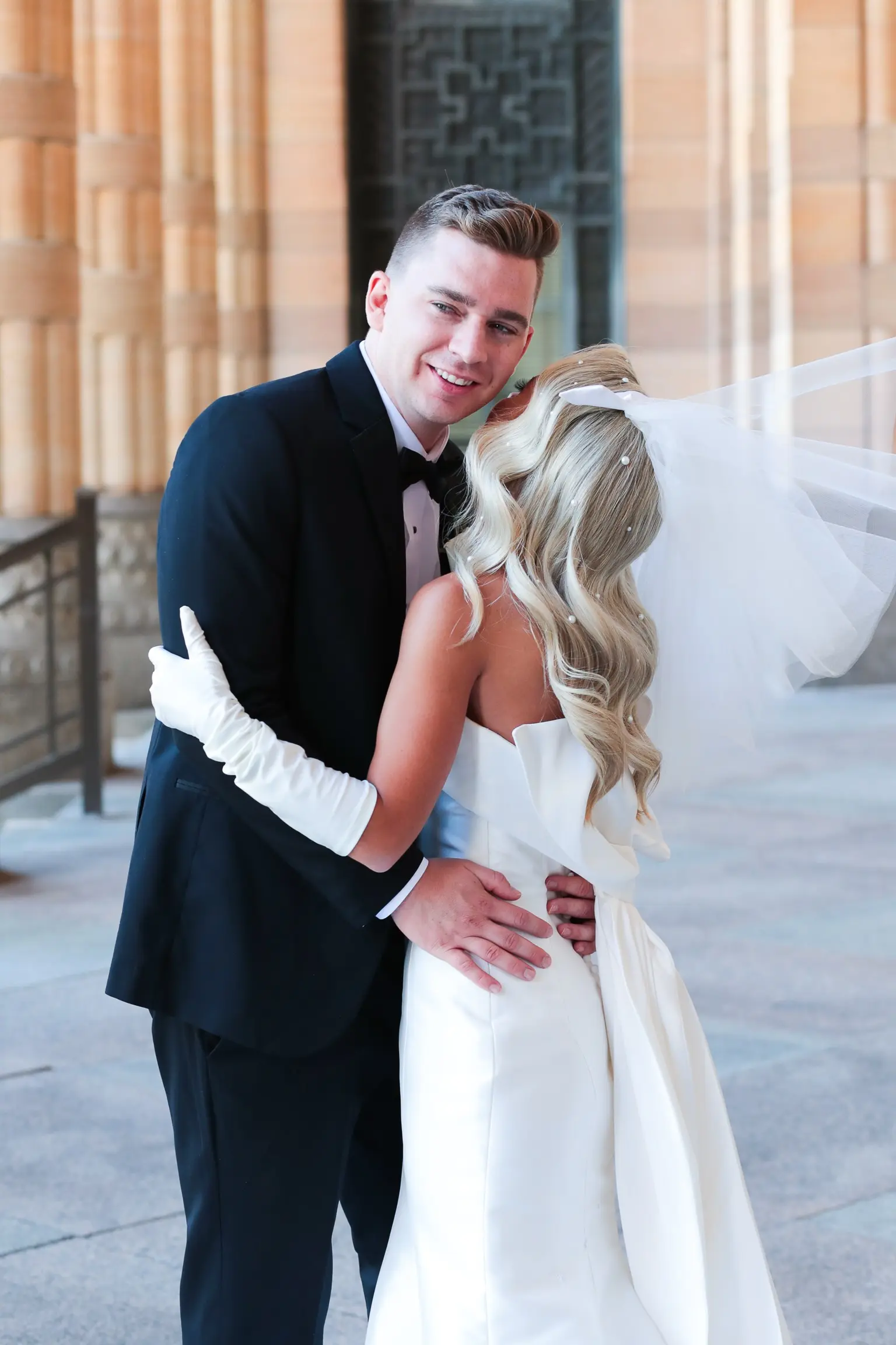 Bride In Simple Satin Wedding Dress With Gloves Called Mitchell By Maggie Sottero