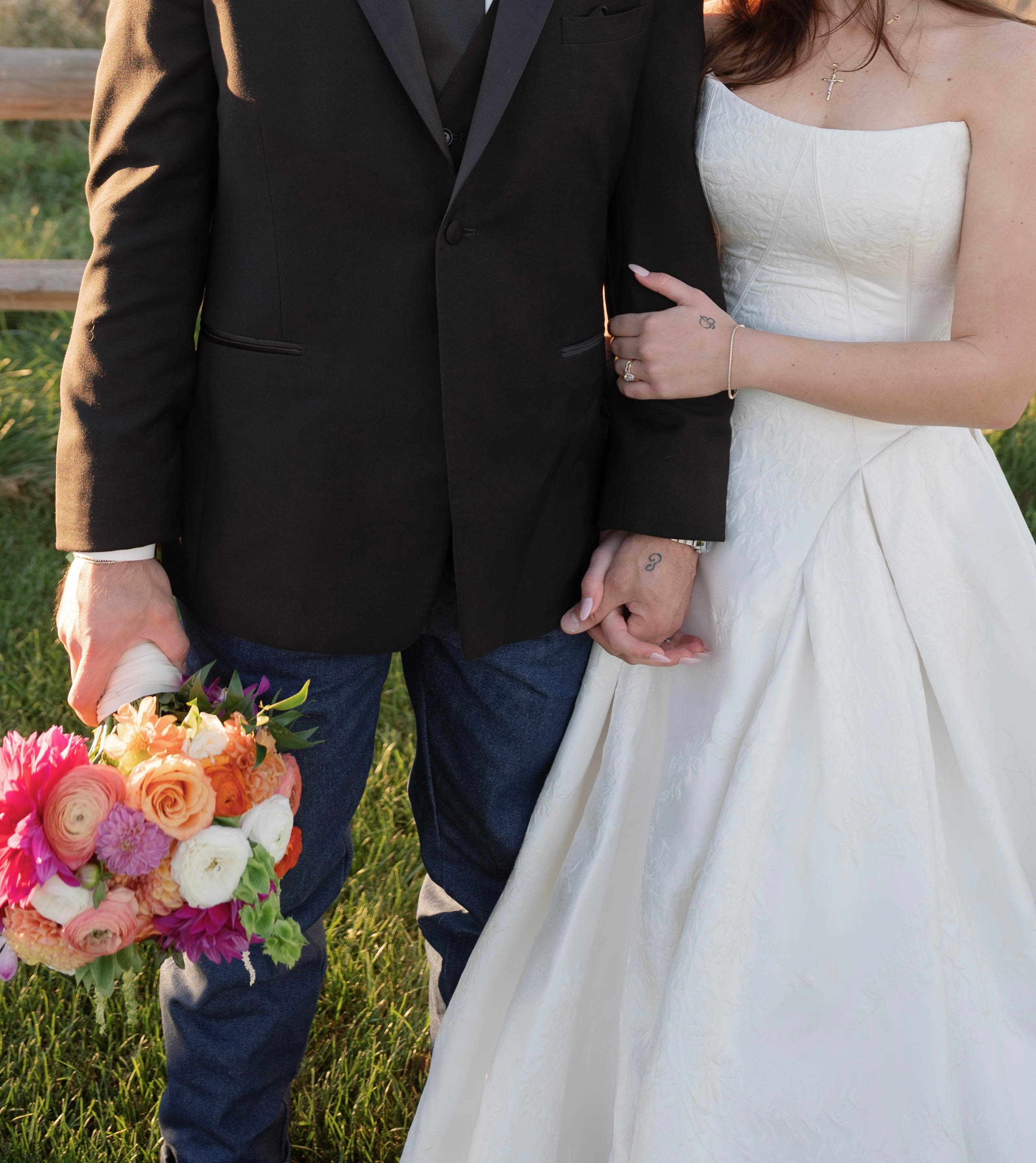 Bride Wearing Jacquard Ballgown Wedding Dress Called Fortune Marie By Maggie Sottero holding bouquet with groom