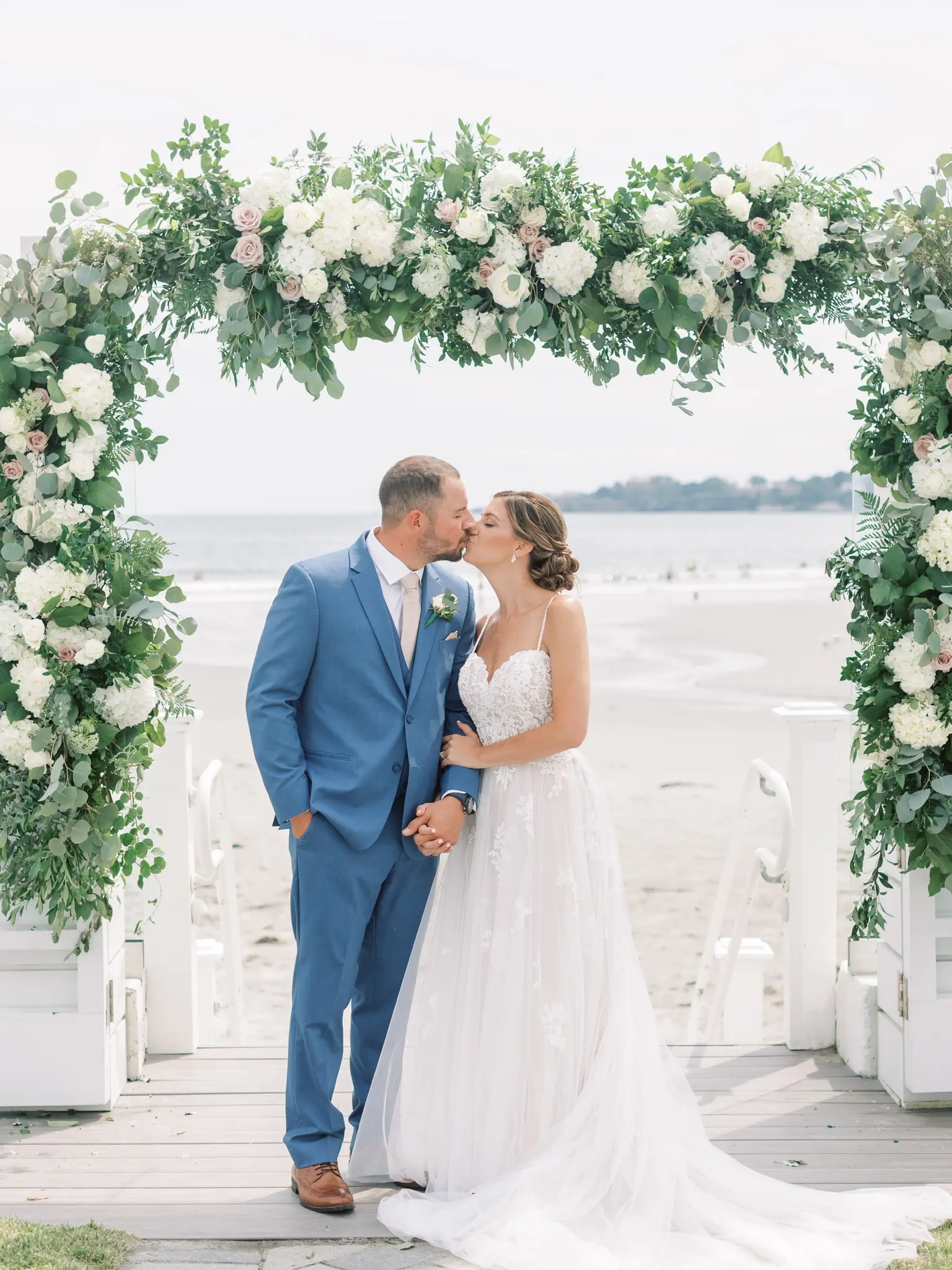 Bride Wearing Boho Sheath Wedding Dress Called Marisol By Rebecca Ingram Kissing Groom