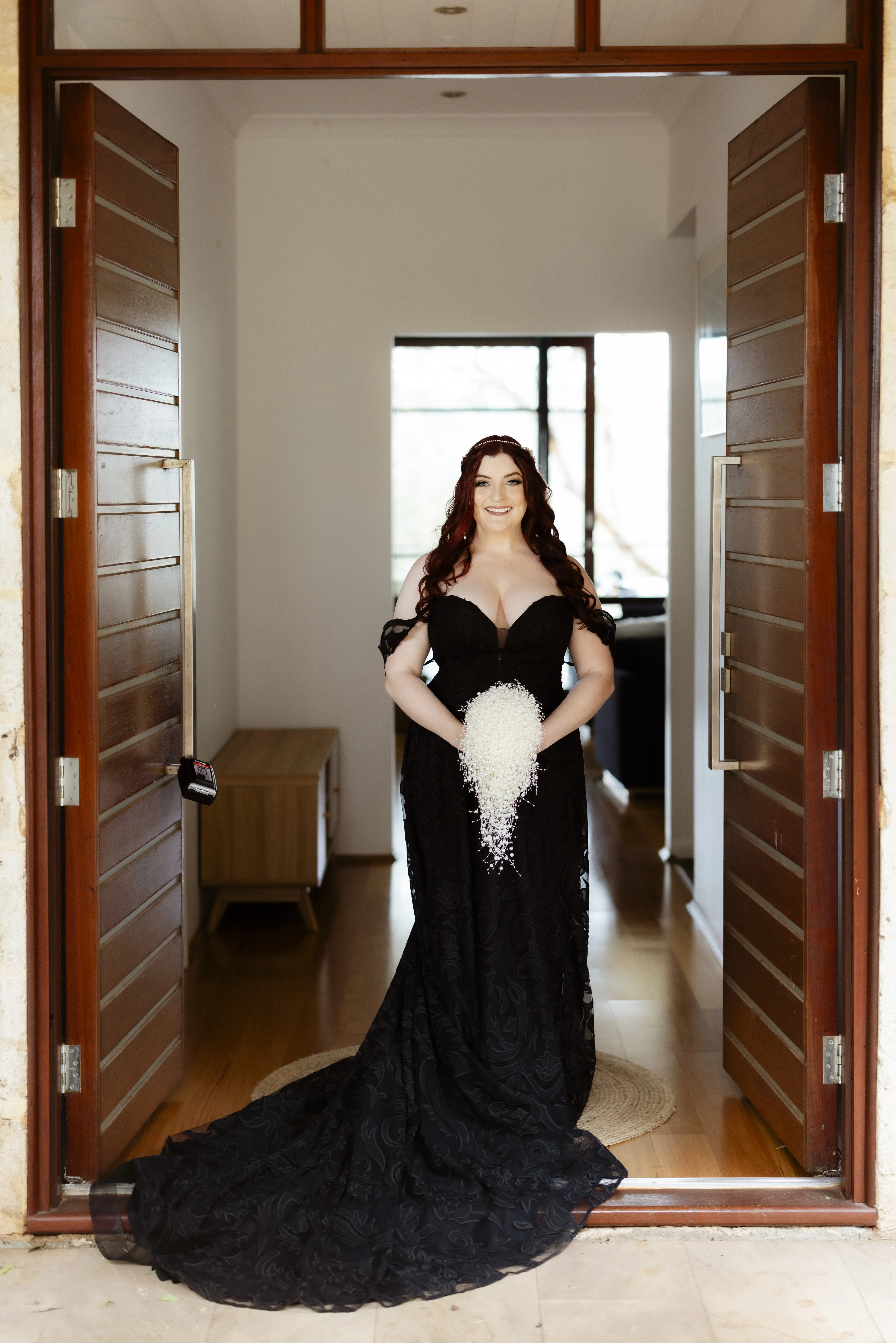 Bride Wearing Black Lace Wedding Dress Called Penny By Maggie Sottero With Unique White Bouquet