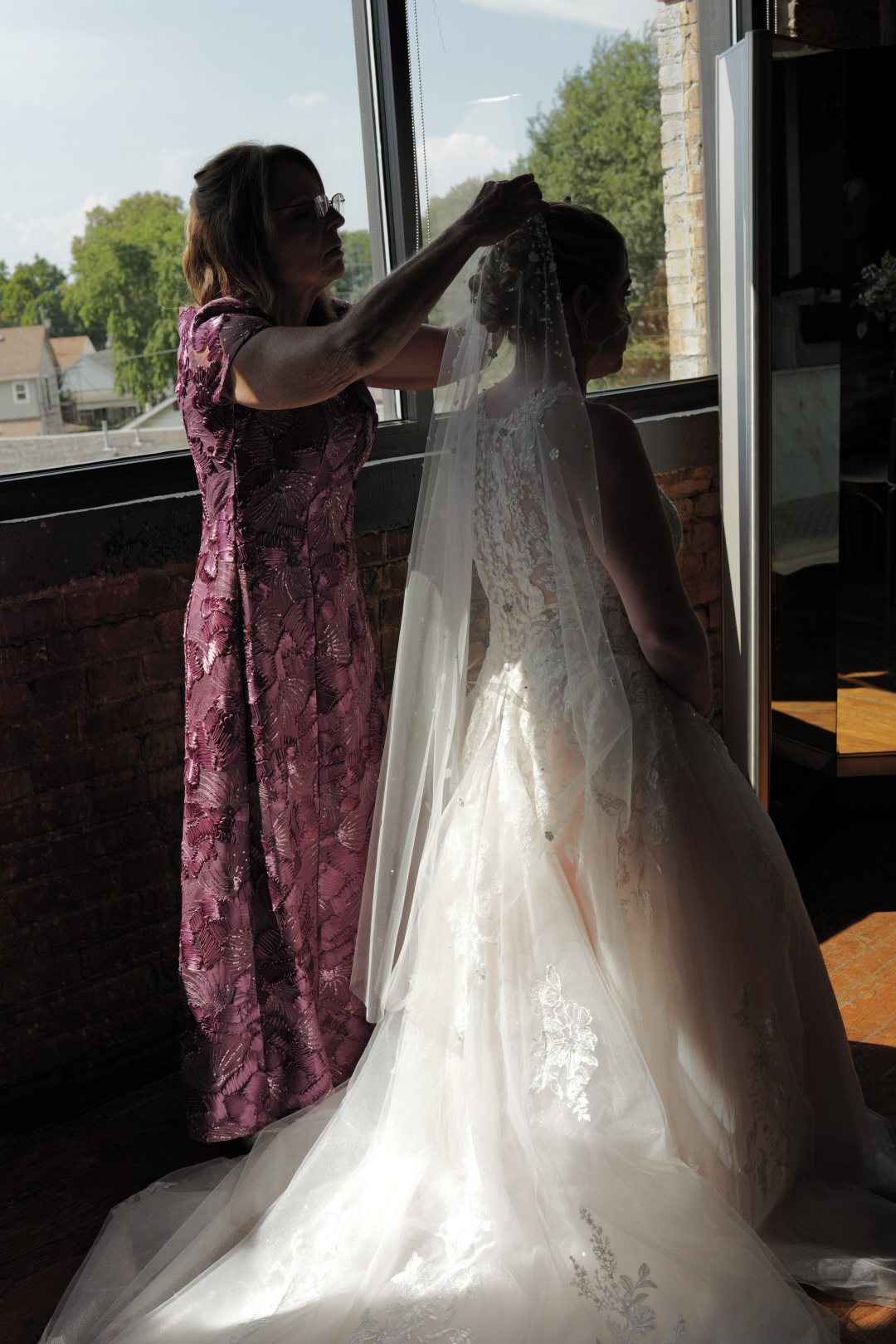 Bride Wearing Lace A-line Wedding Dress Called Rickie By Maggie SotteroGetting Her Veil Put On
