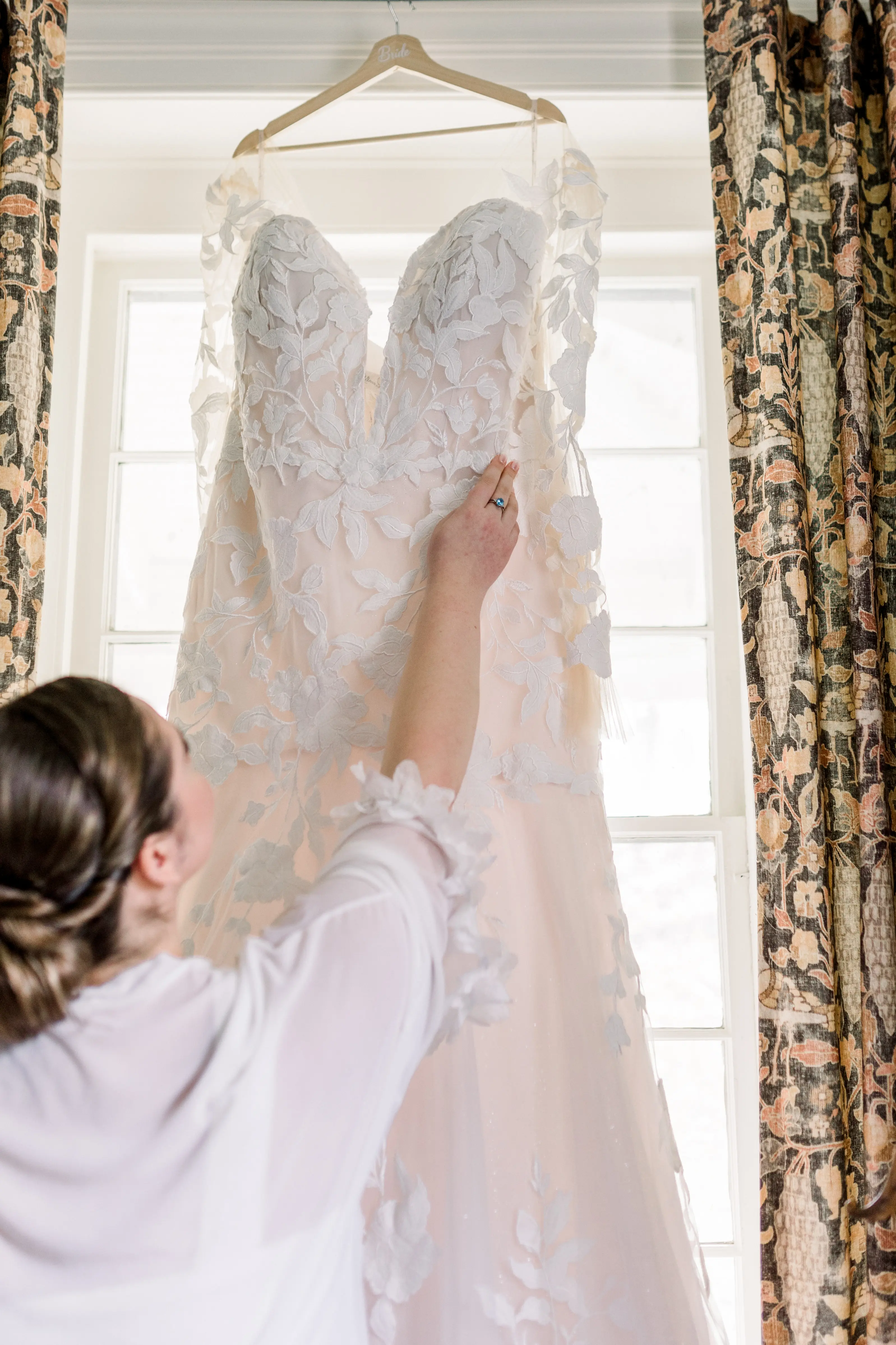 Bride looking at Hattie by Rebecca Ingram