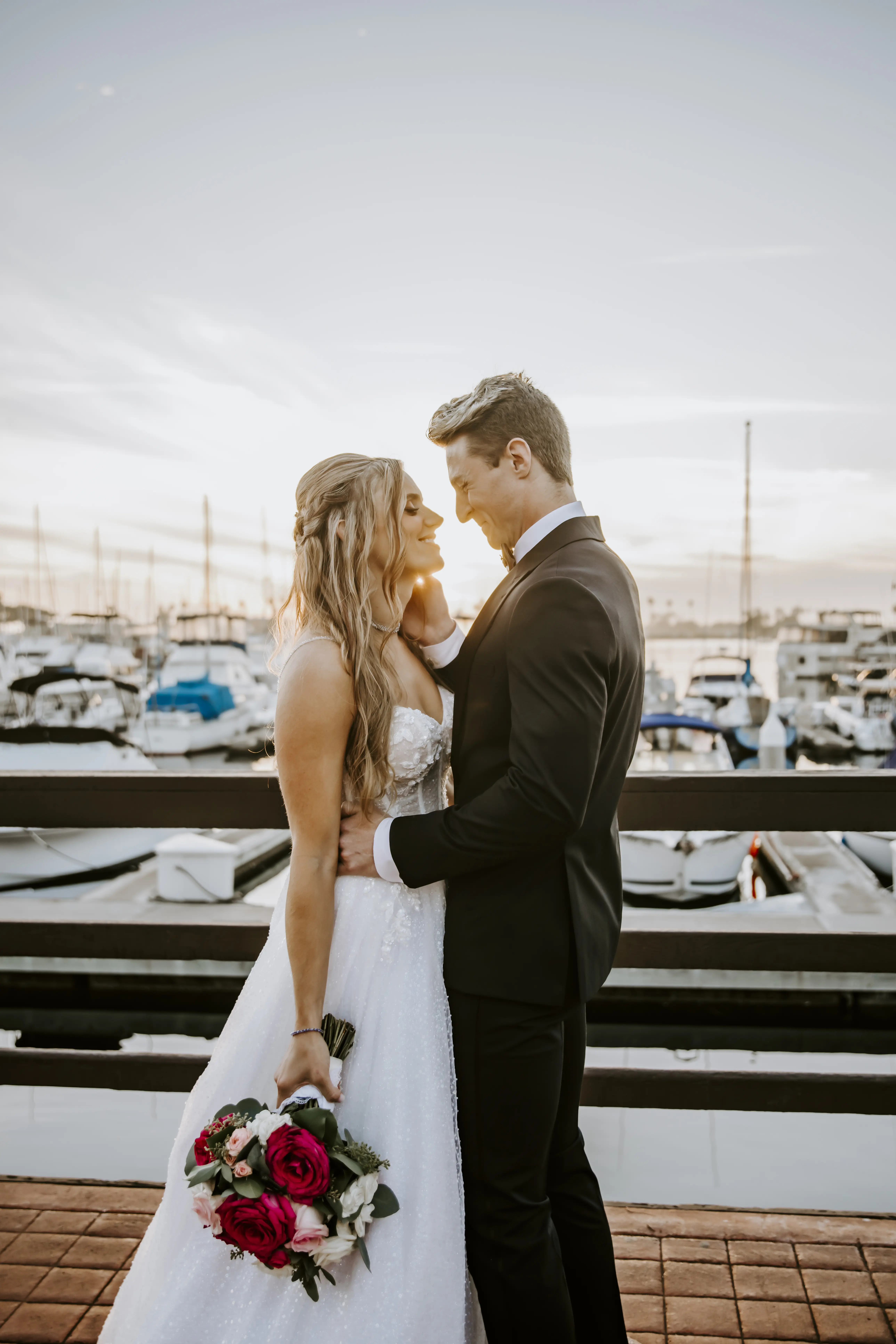 Bride Wearing Sparkly Ballgown Wedding Dress Called Shasta By Sottero And Midgley With Groom At A Marina