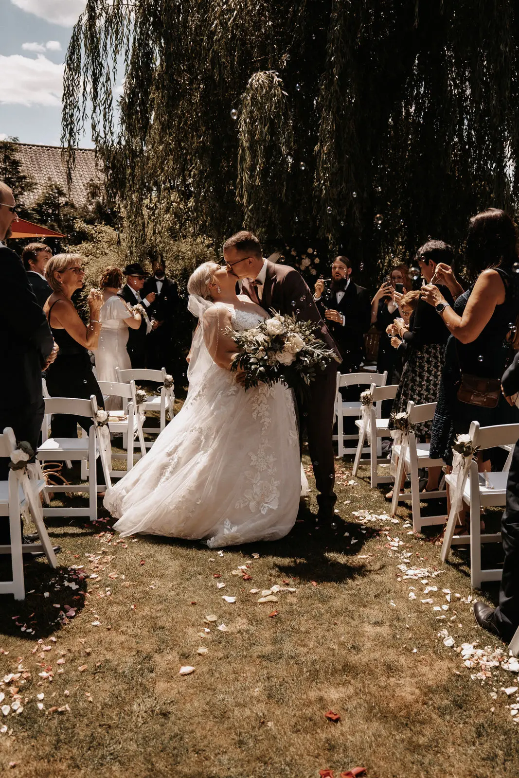 Groom With Bride Wearing Ball Gown With Shimmery Lace Motifs Valona By Sottero And Midgley