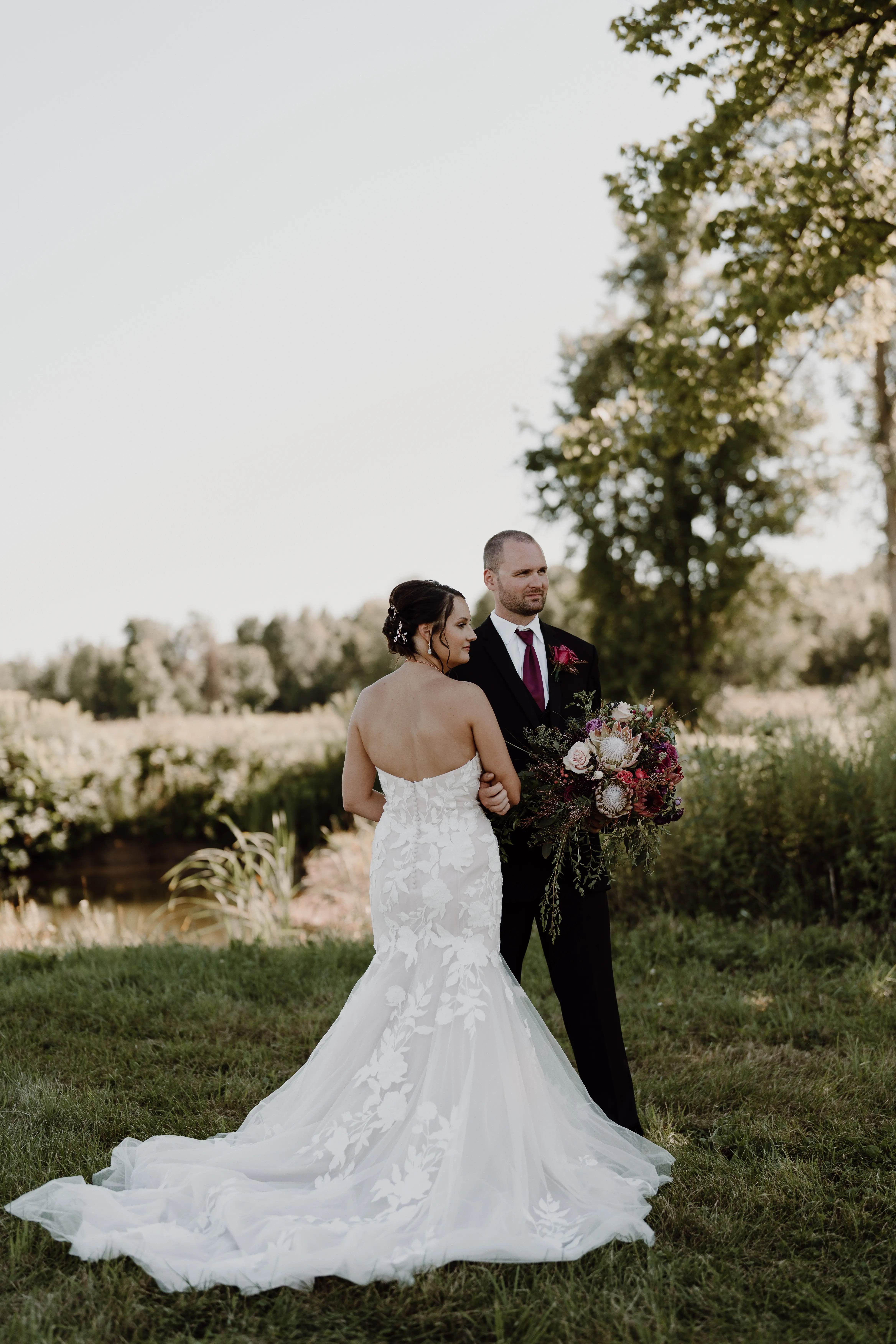 Groom With Bride Wearing Mermaid Wedding Dress With Oversized Lace Hattie By Rebecca Ingram