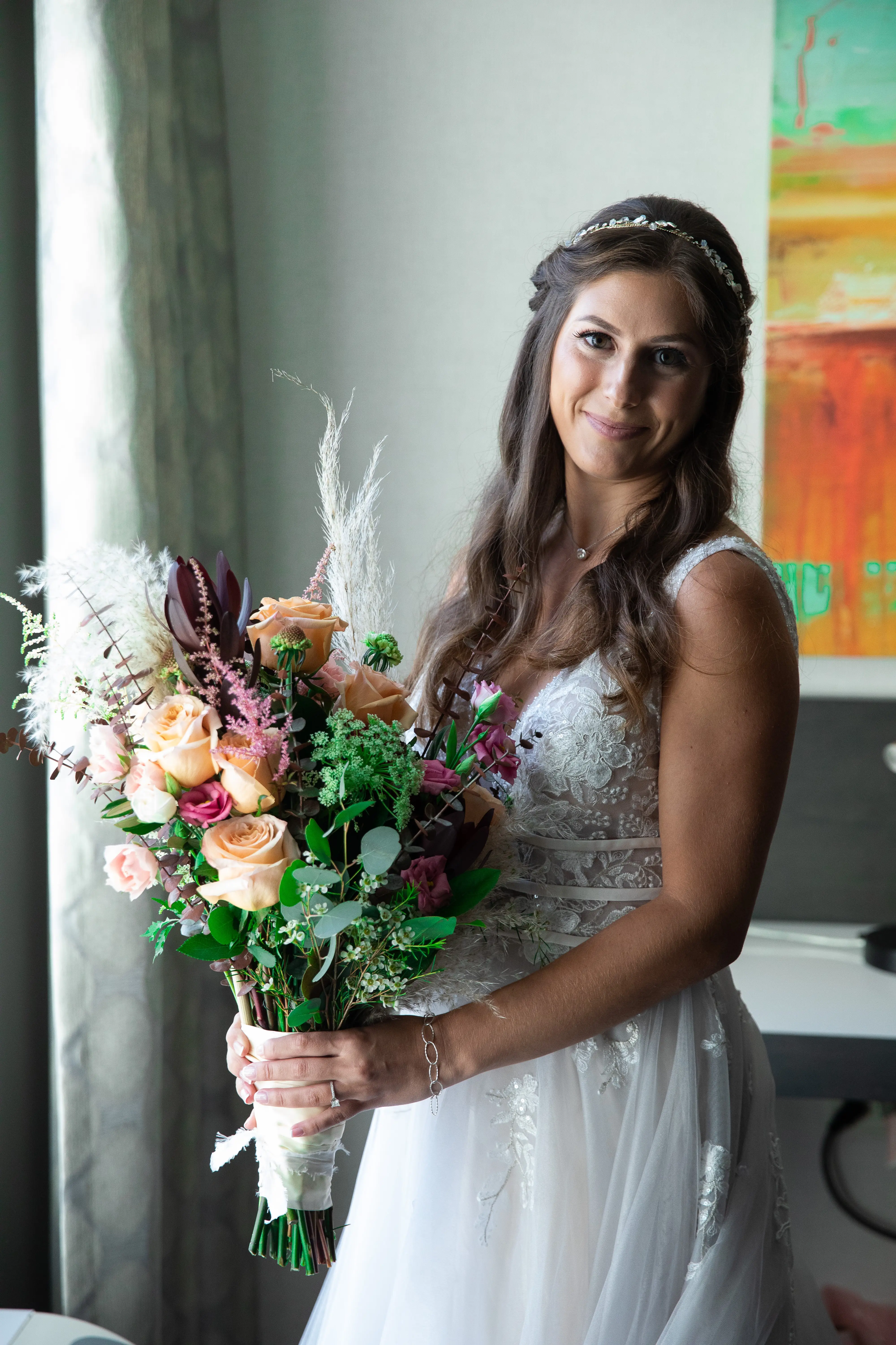 Bride wearing Lace A-line Wedding Dress called Raelynn by Rebecca Ingram