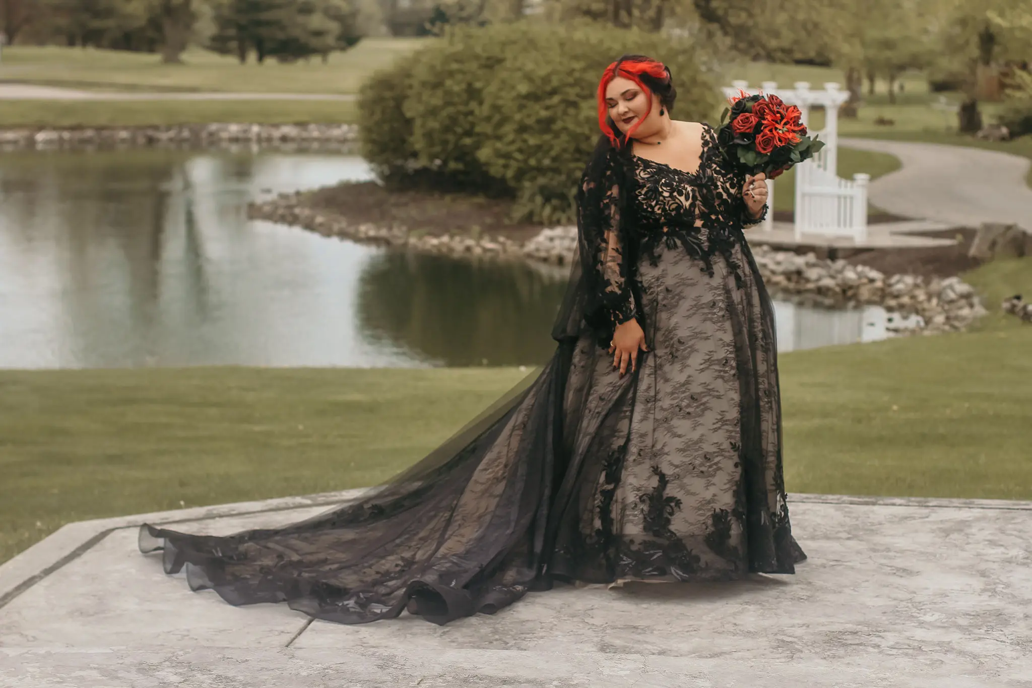 Groom Kissing Bride In Black Long Sleeve Ball Gown Wedding Dress Called Zander By Sottero And Midgley
