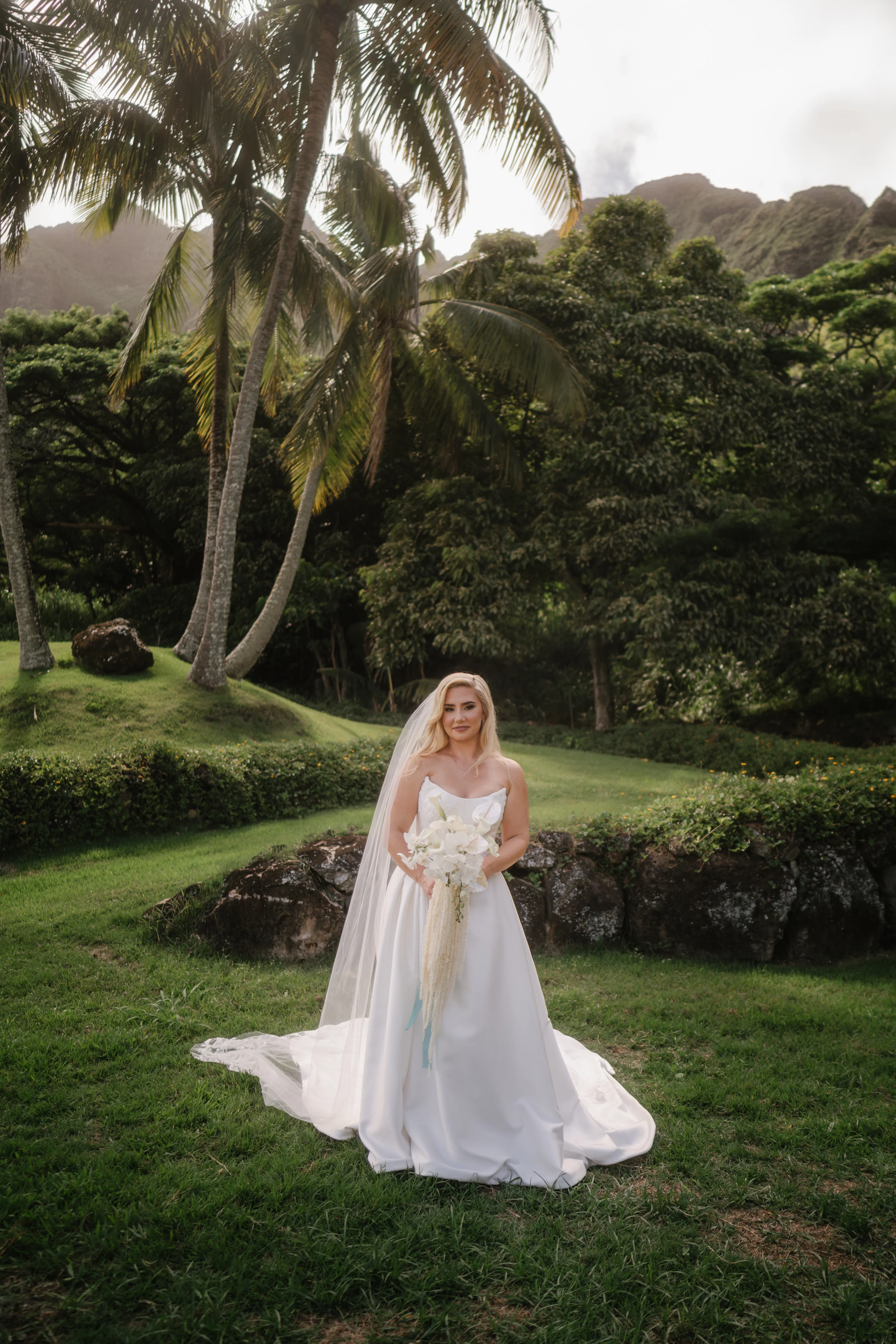 Bride Wearing Sexy Slit Satin Wedding Dress Called Amadora By Sottero And Midgley With A Veil On An Exotic Island