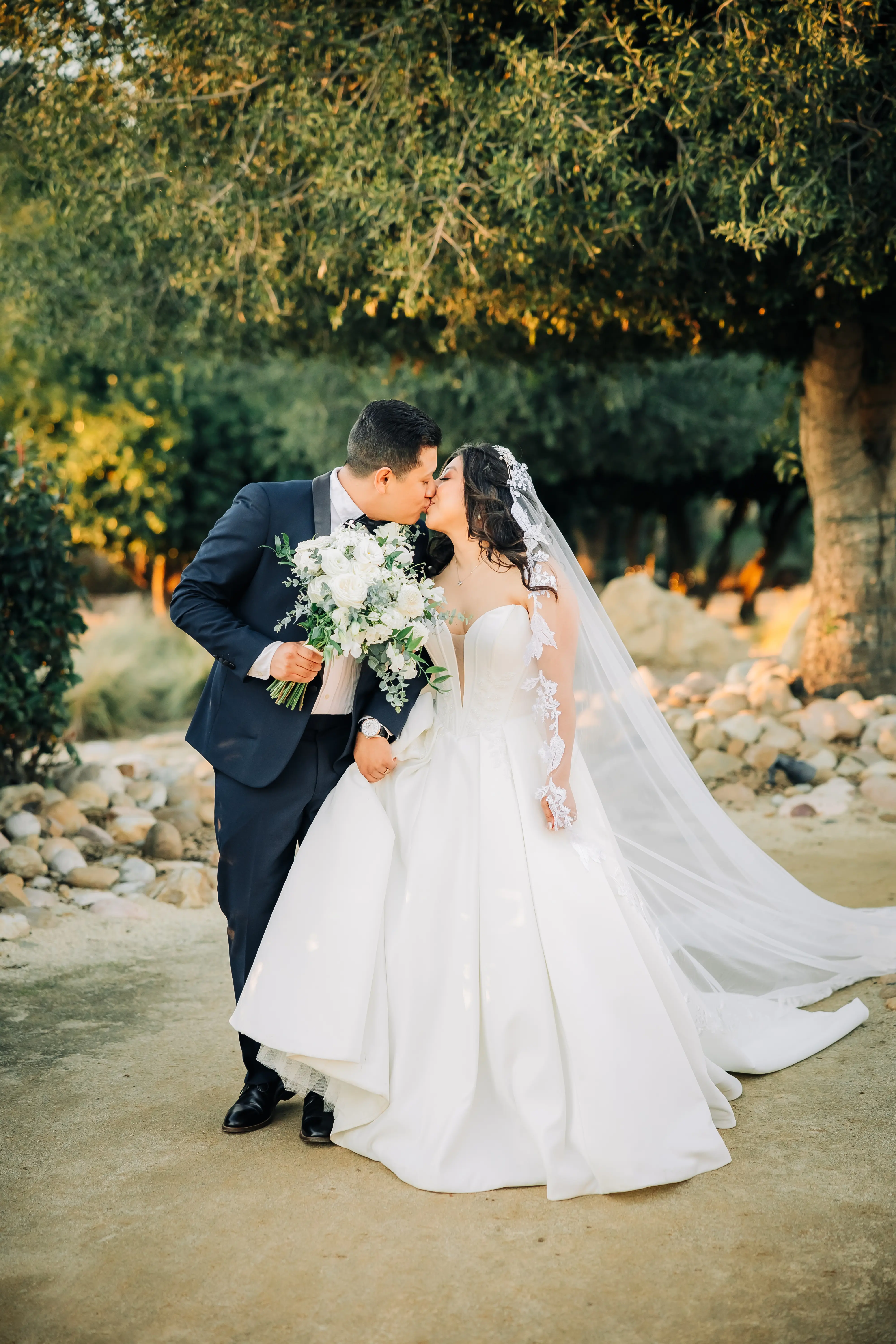 Bride Wearing Sexy Ballgown Wedding Dress Called Derrick By Maggie Sottero Kissing Groom