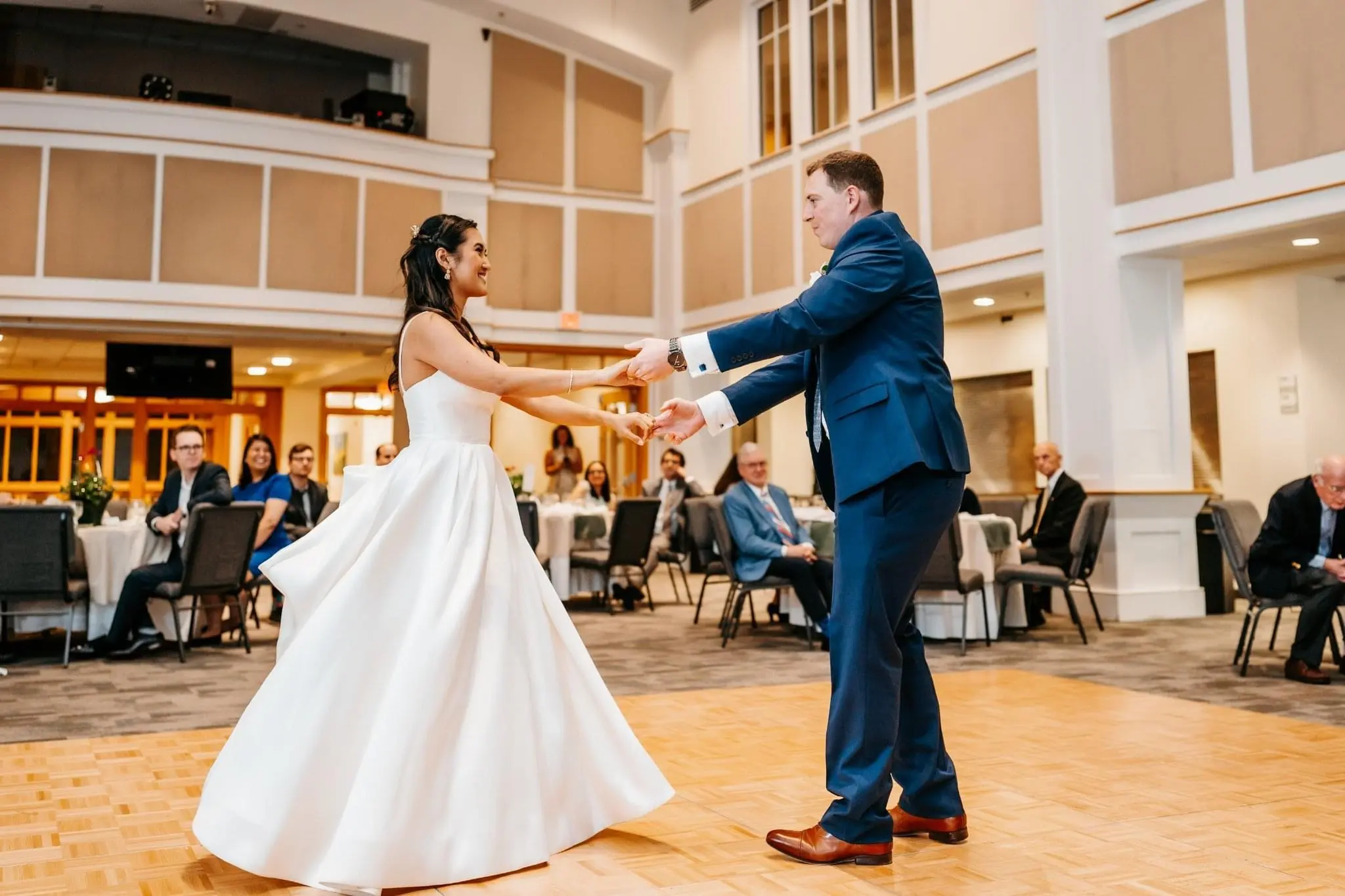 Husband Dancing With Wife Wearing Satin Ball Gown Wedding Dress Named Selena By Maggie Sottero