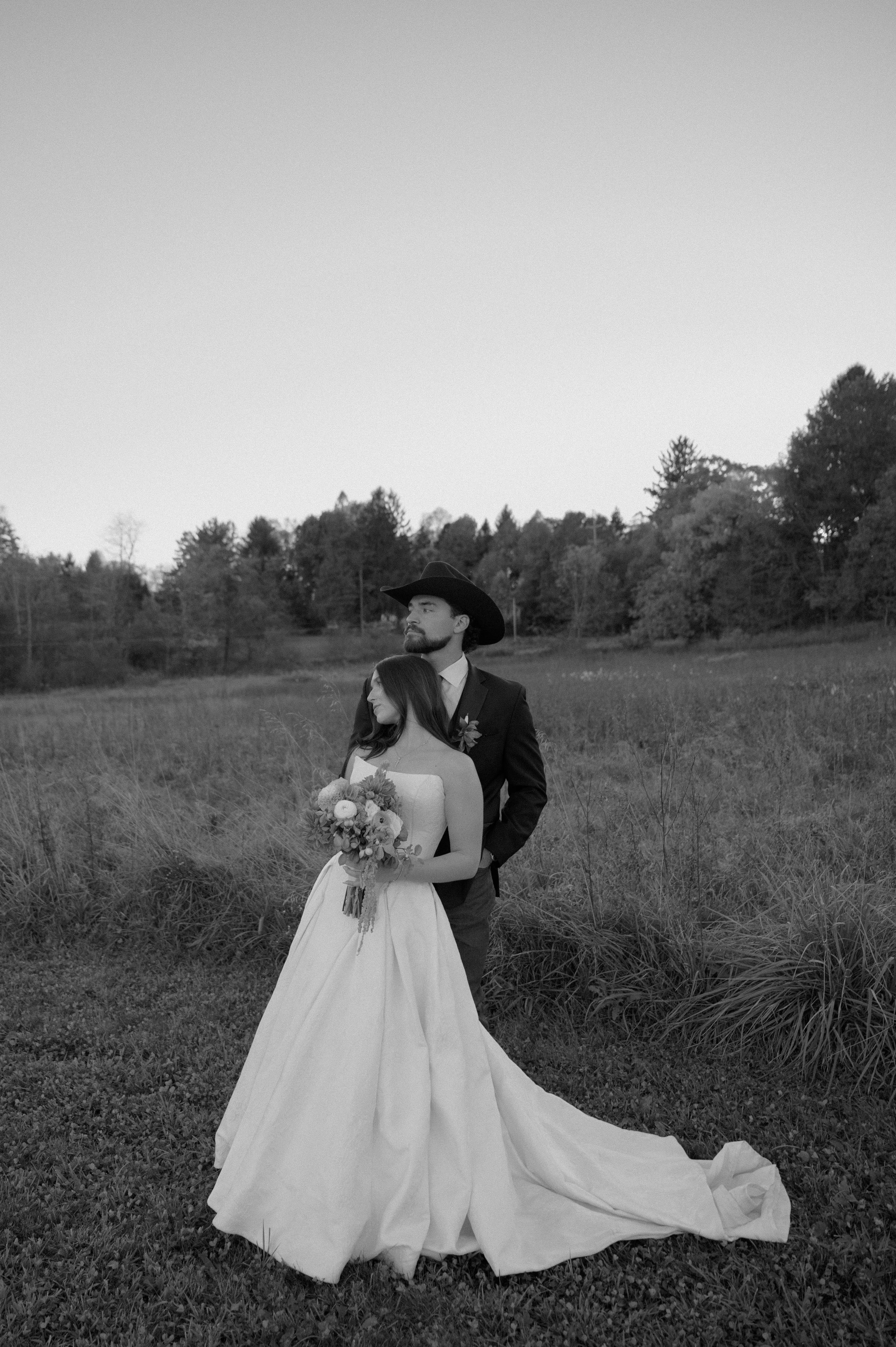 Black and white image of Bride Wearing Jacquard Ballgown Wedding Dress Called Fortune Marie By Maggie Sottero