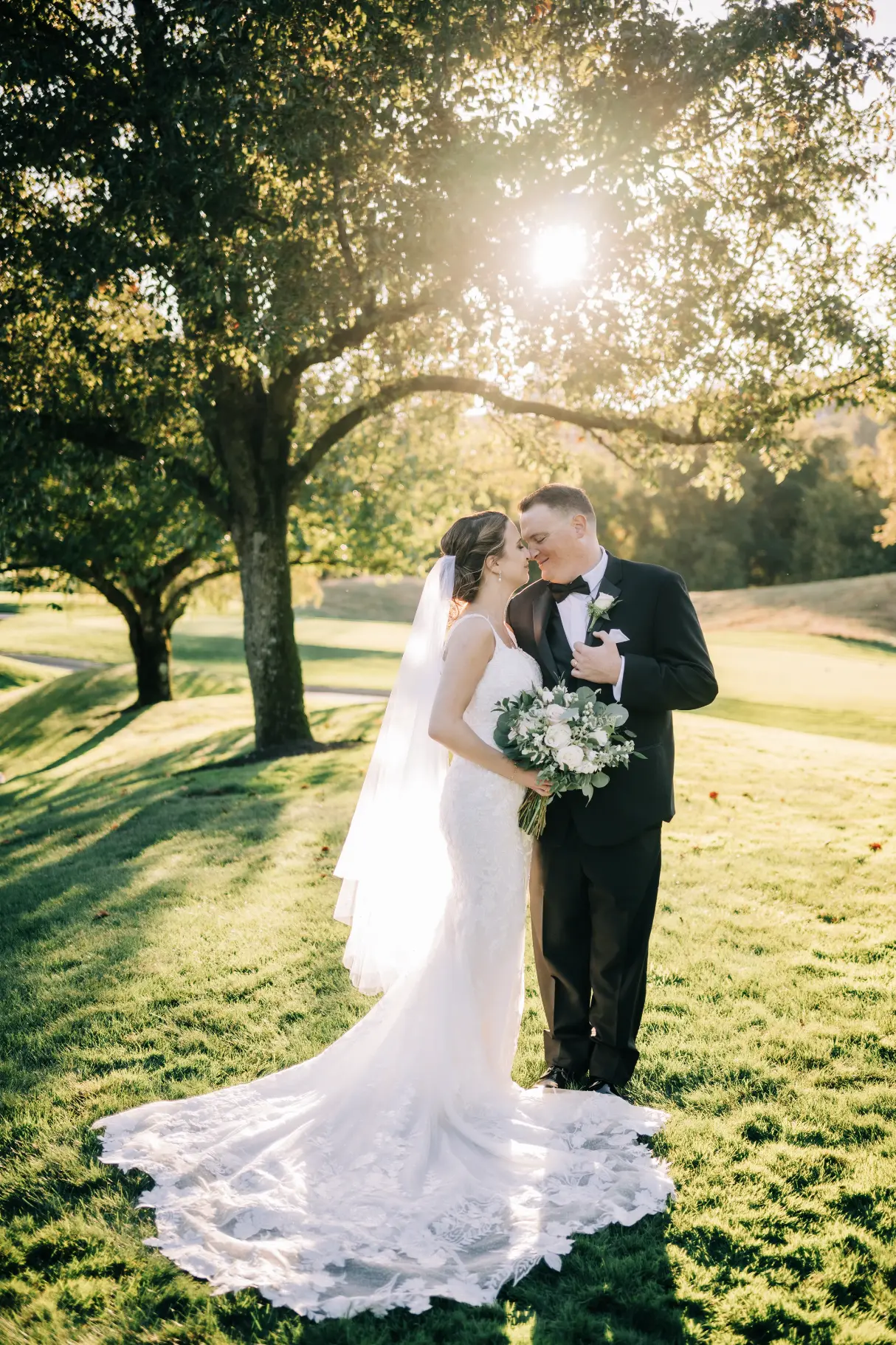 Bride Wearing Nature Lace Wedding Dress Called Albany By Maggie Sottero With Groom In A Sunny Meadow