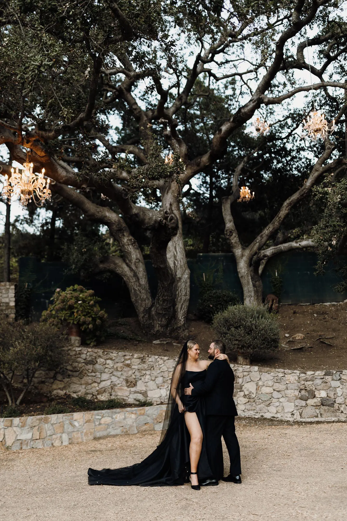 Bride wearing Aspen wedding dress by Sottero and Midgley with her husband