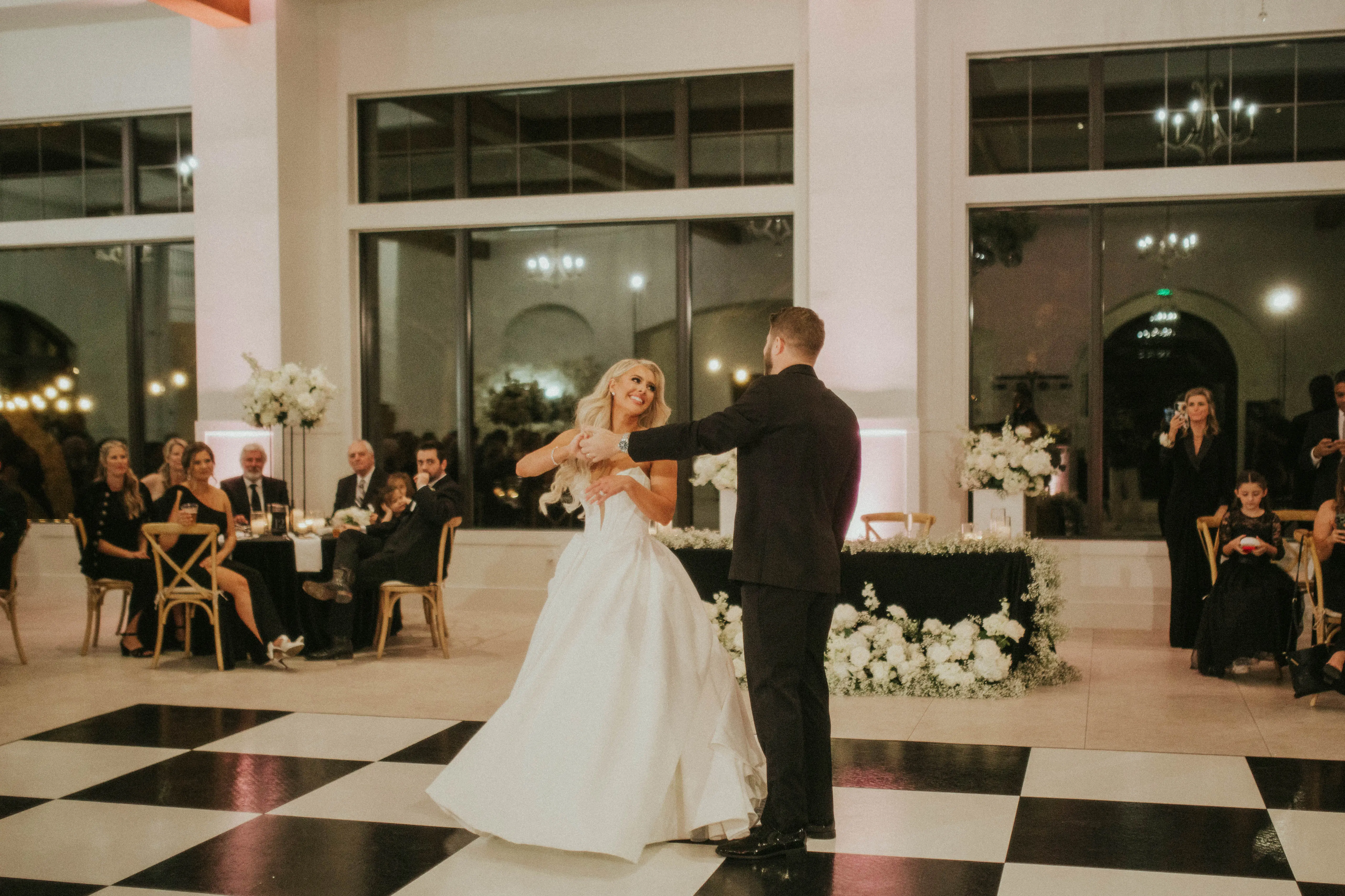 Bride wearing Derrick by Maggie Sottero dancing with her husband