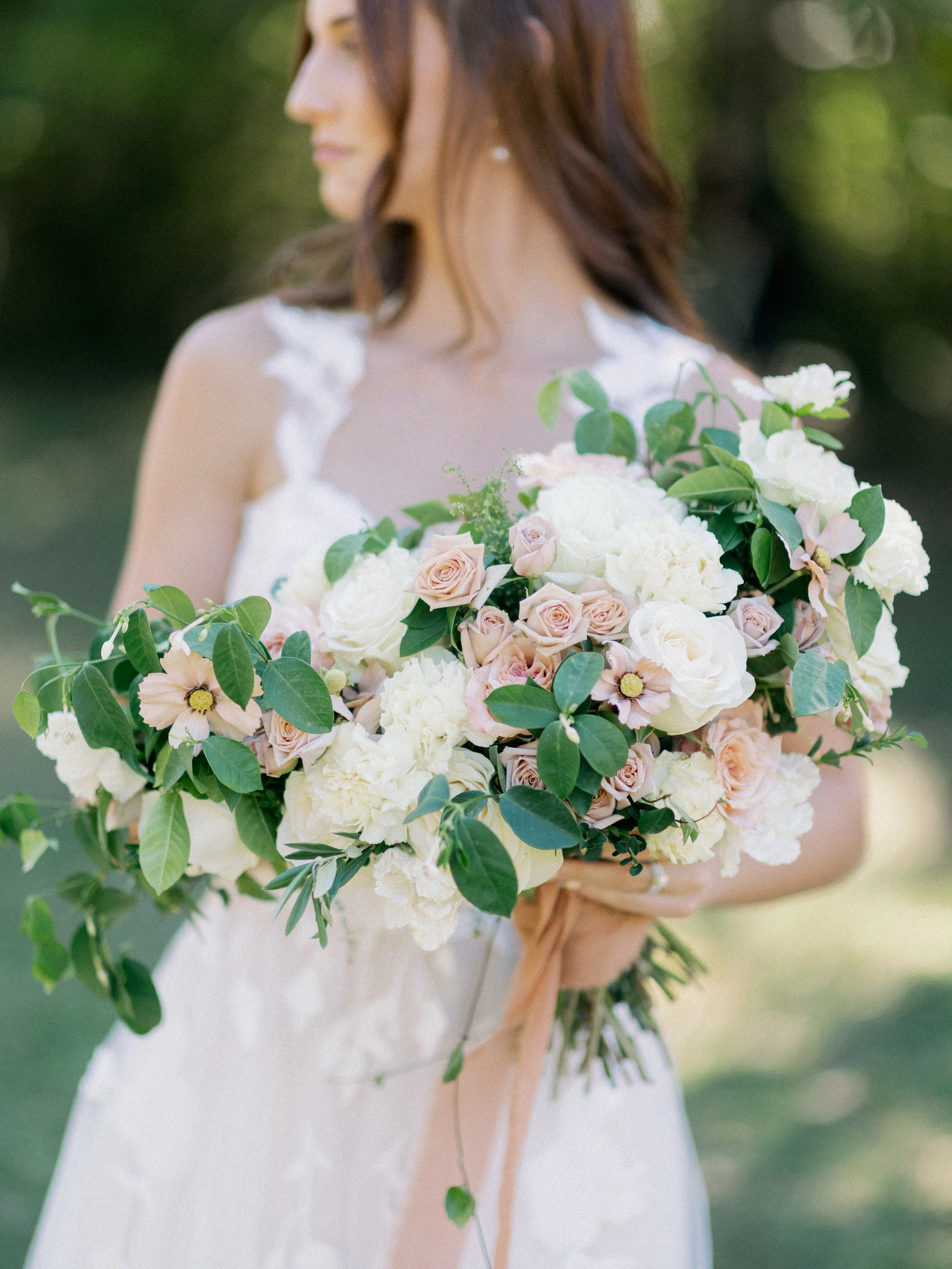 Bride Wearing Plunging V-Neckline Bridal Dress Named Hattie Lane Marie By Rebecca Ingram Bride Holding Flowers