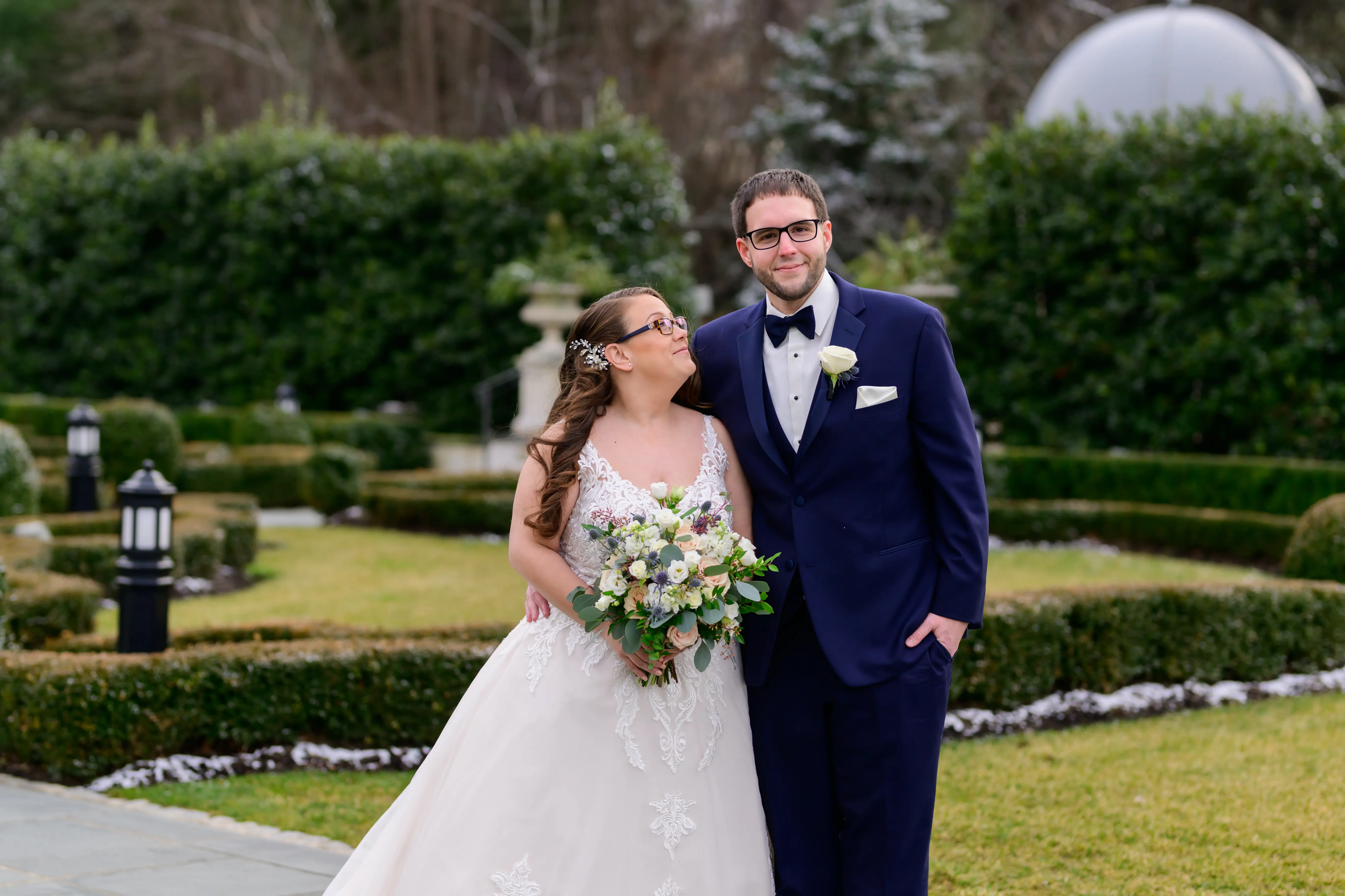 Bride in V neck ballgown called Trinity Lynette by Maggie Sottero with grrom
