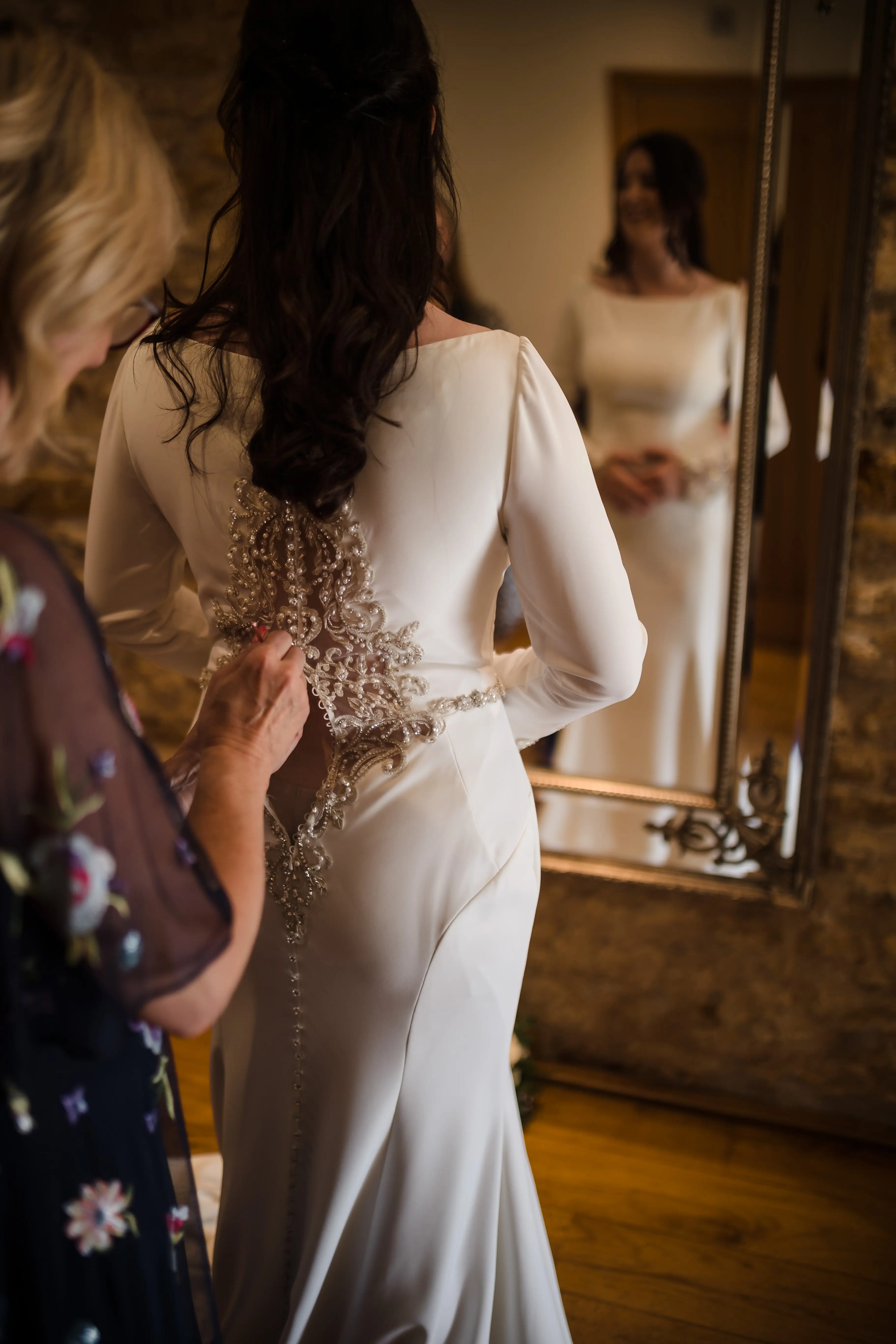 Bride Wearing Simple Keyhole Back Wedding Dress Called Aston By Sottero and Midgley Getting Buttoned Up
