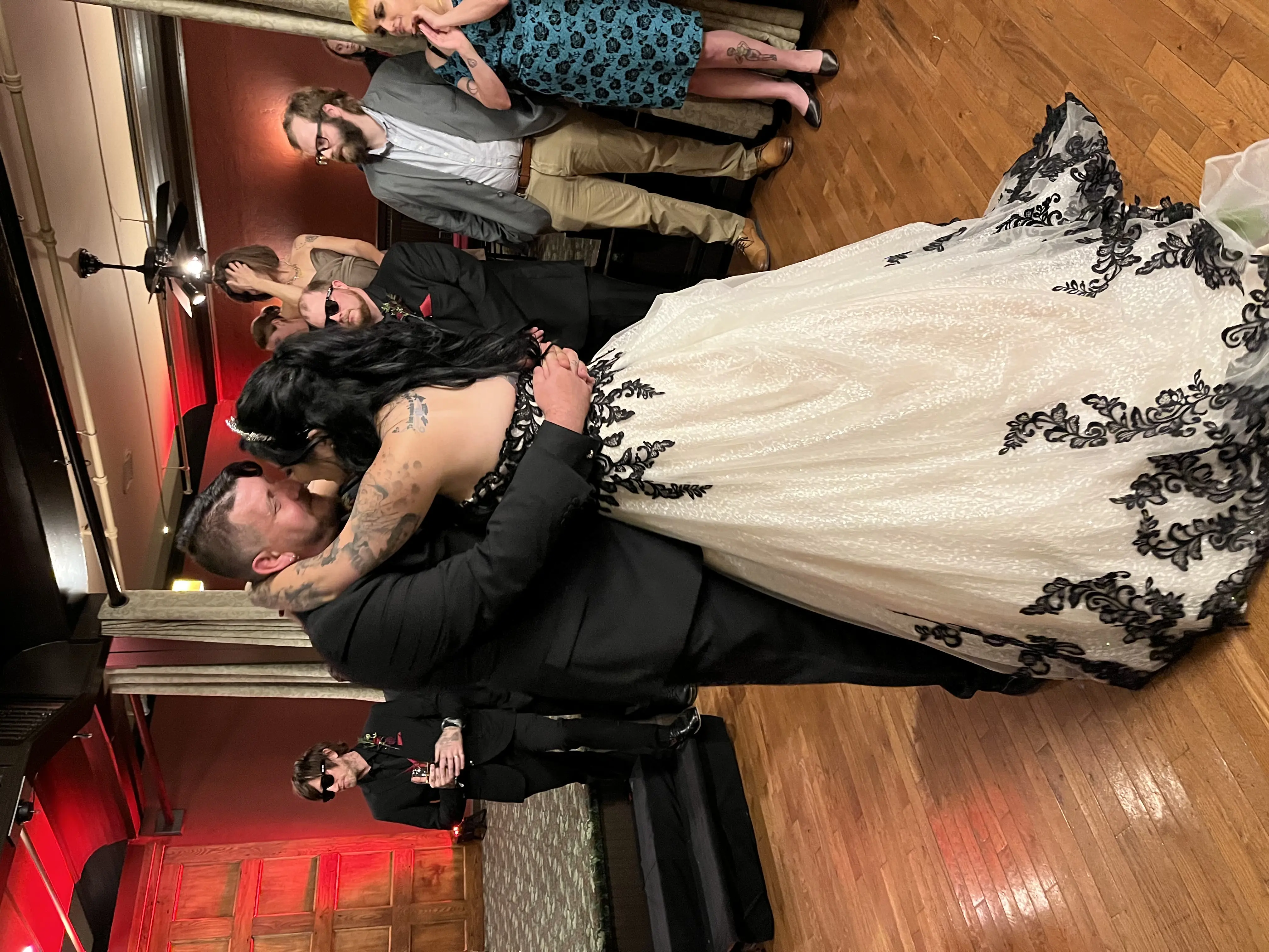 Bride wearing Black Lace Ballgown Wedding Dress called Tristyn by Maggie Sottero and the groom dancing at their reception