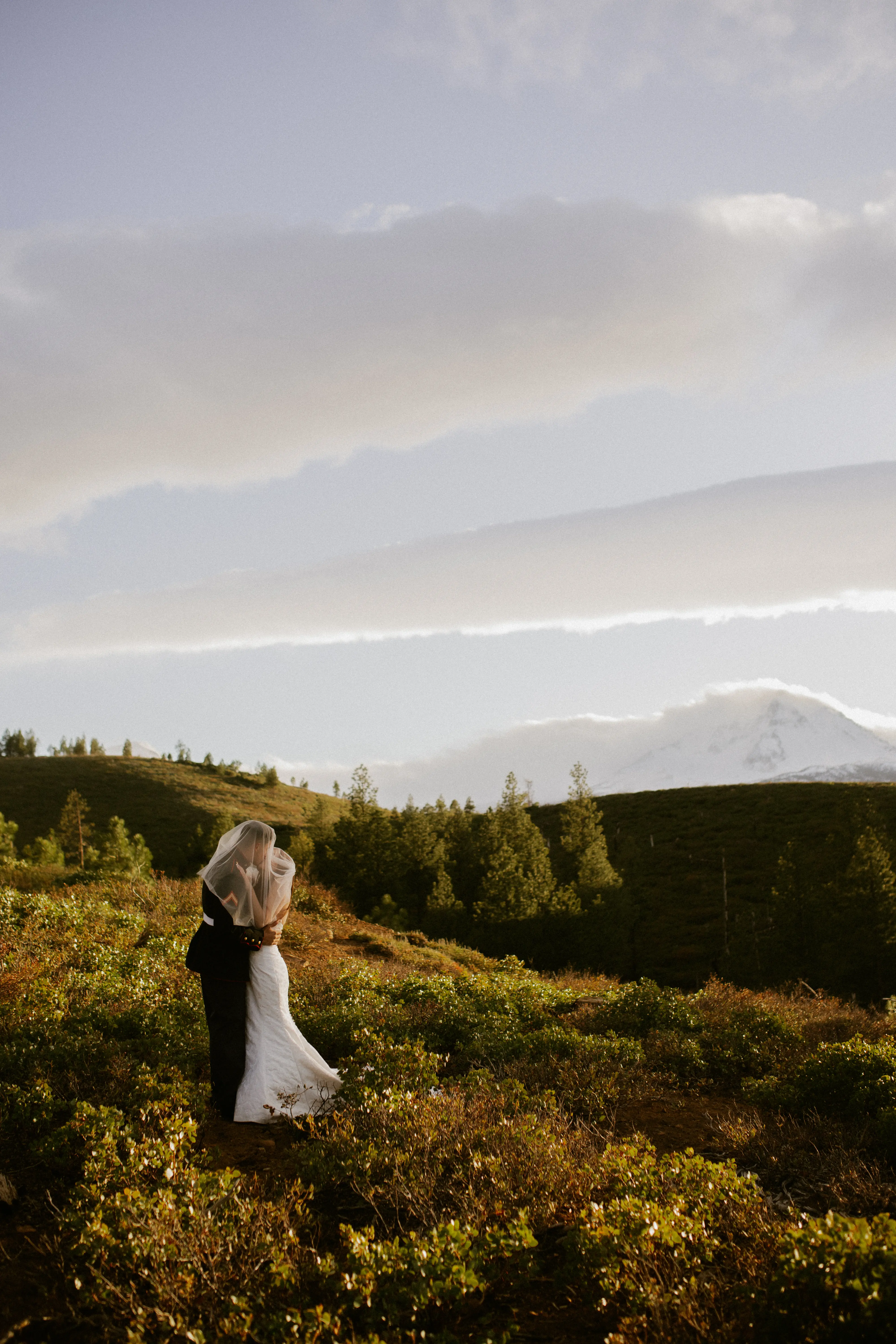 Bride wearing Hilo by Maggie Sottero kissing her husband