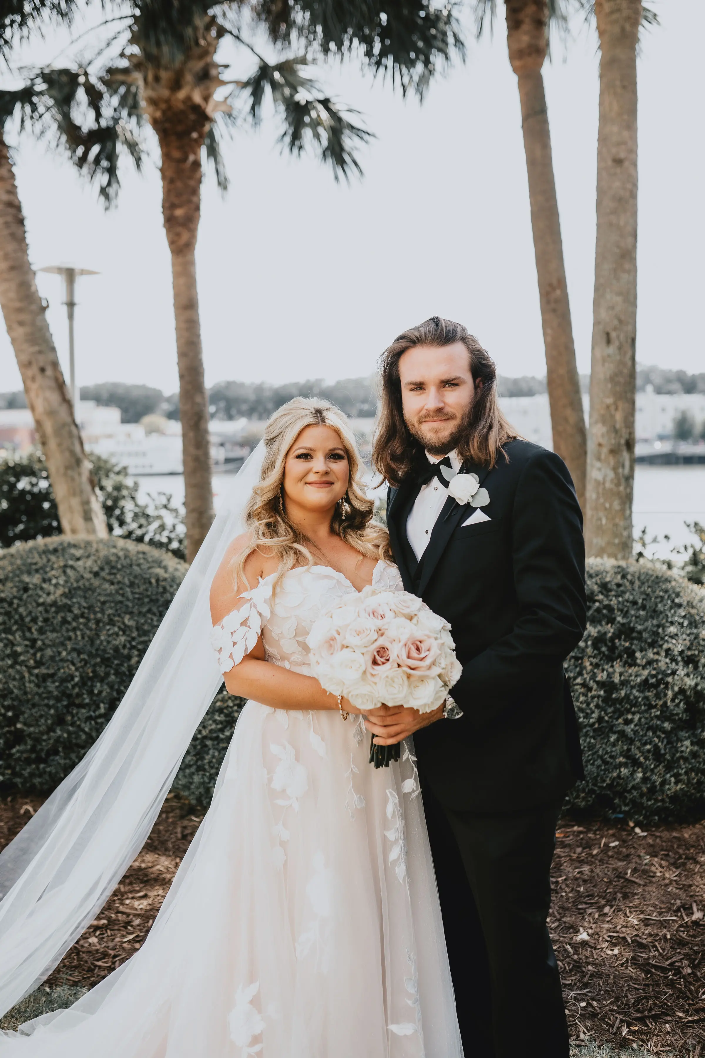 Bride In Lace A-Line Wedding Dress Called Hattie Lane By Rebecca Ingram With Groom