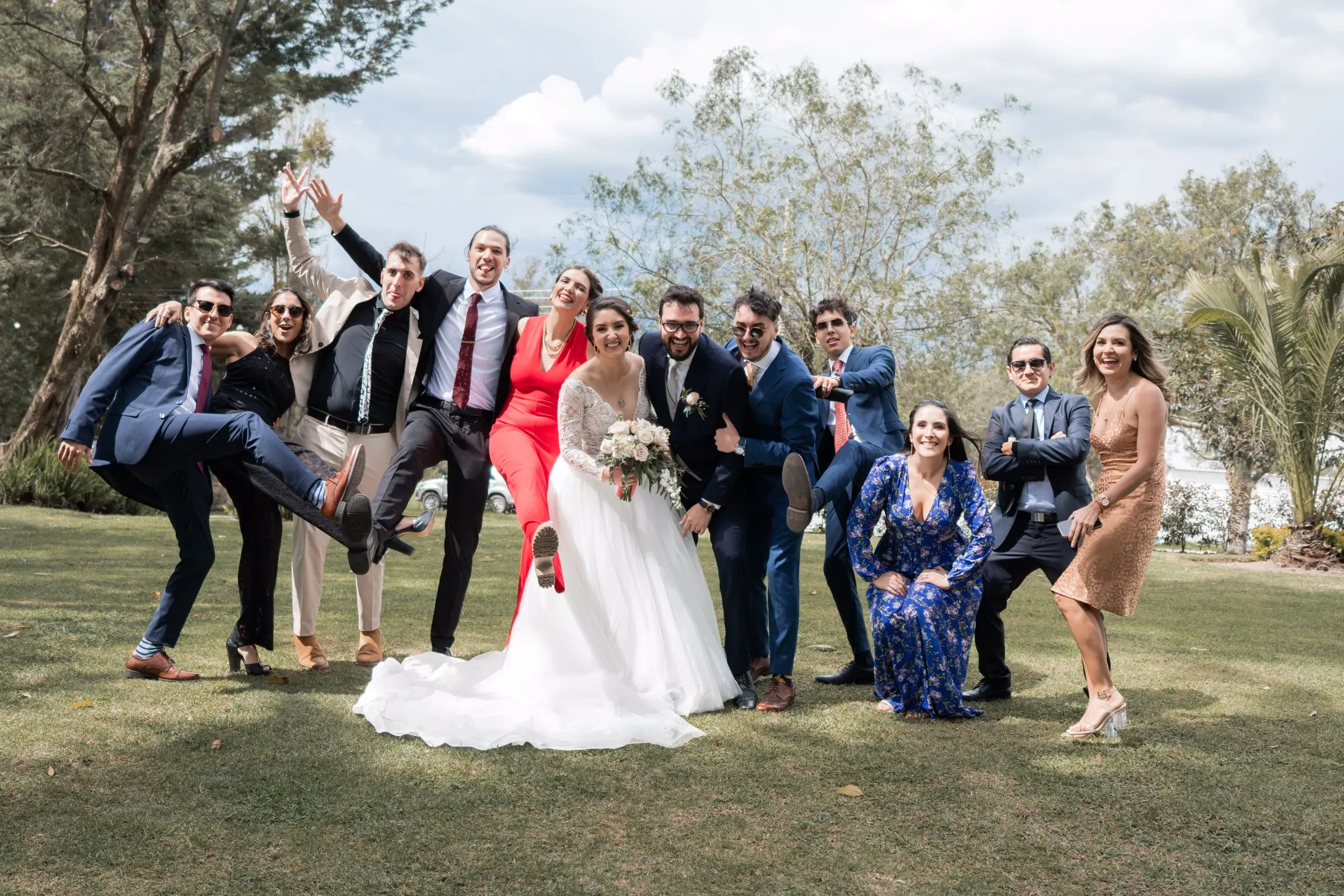 Bride in Long Sleeve Ball Gown Wedding Dress Named Mallory Dawn by Maggie Sottero with Wedding Party
