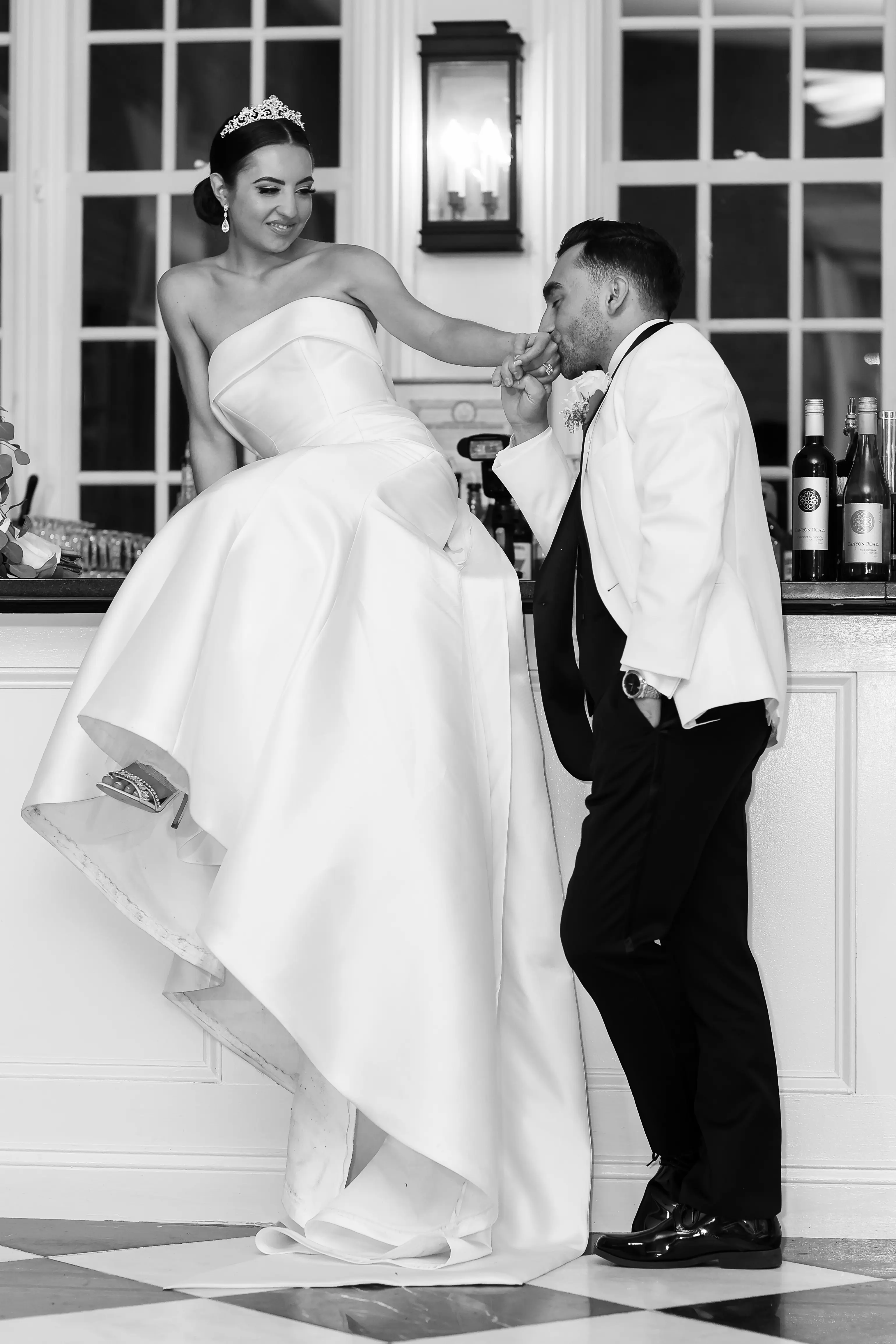 Bride And Groom Together. Bride Wearing Unique Strapless Wedding Gown With Statement Bow Called Mitchell By Maggie Sottero