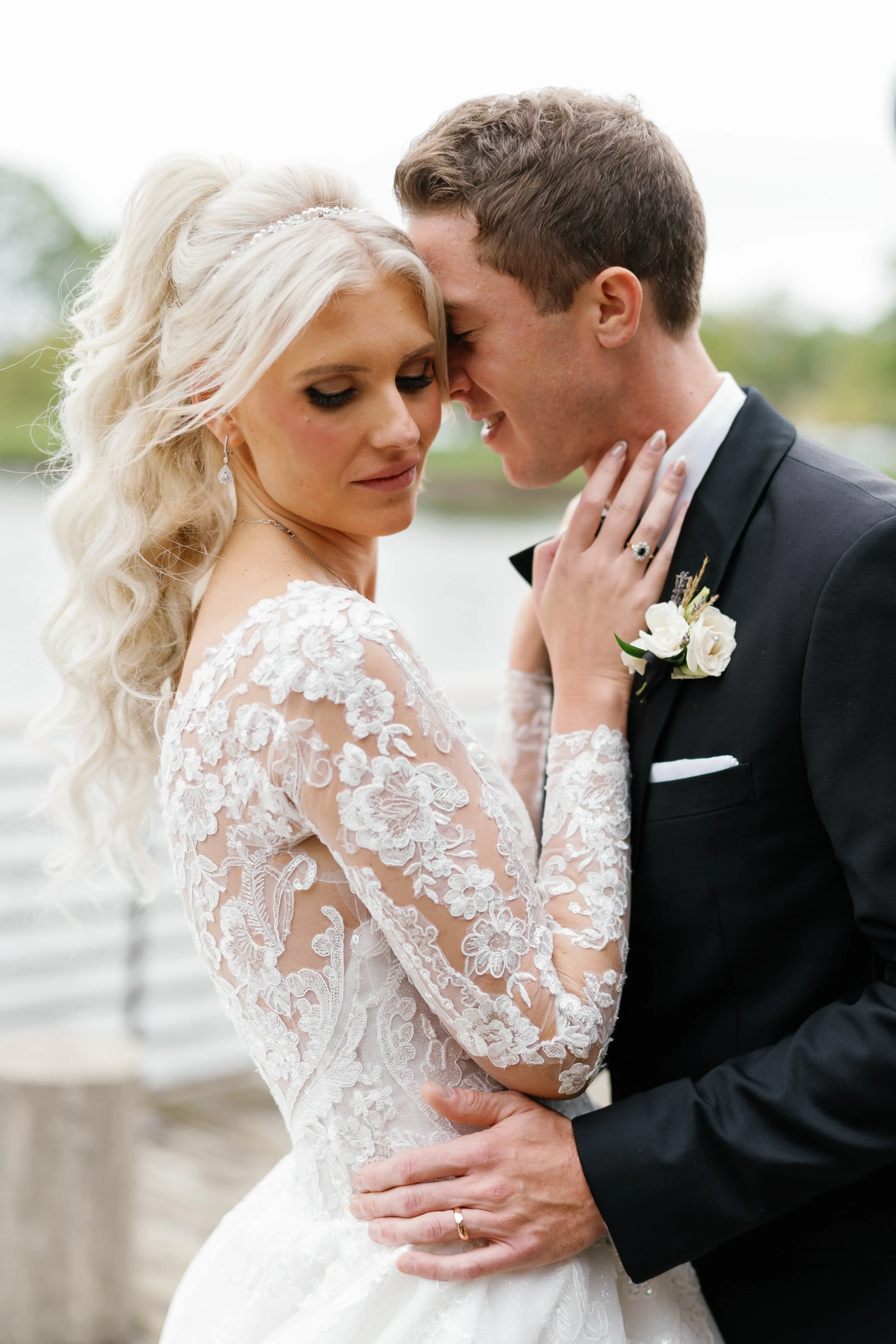 Bride Wearing Lace Princess Wedding Dress Called Norvinia By Sottero And Midgley With Groom Holding Her