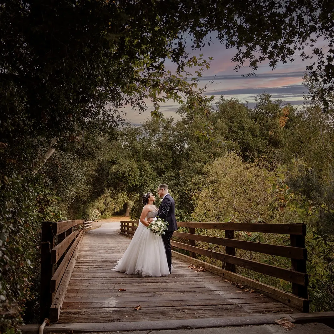 Bride Wearing Sparkly Princess Wedding Dress Called Elton By Sottero And Midgley With Groom On A Bridge