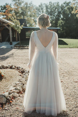 Bride Wearing Long-Sleeve A-Line Wedding Dress Called Joanne By Rebecca Ingram