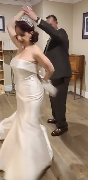 Bride Wearing Classic Simple Wedding Dress Called Mitchell By Maggie Sottero Dancing With Groom