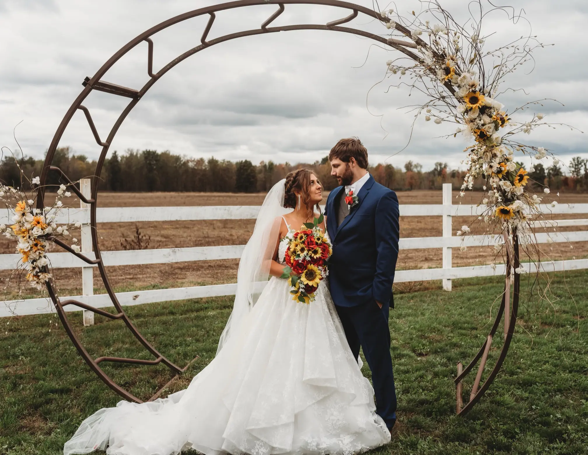 Bride In Lace Ruffled Wedding Dress Called Yuri By Maggie Sottero At Wedding Ceremony With Groom