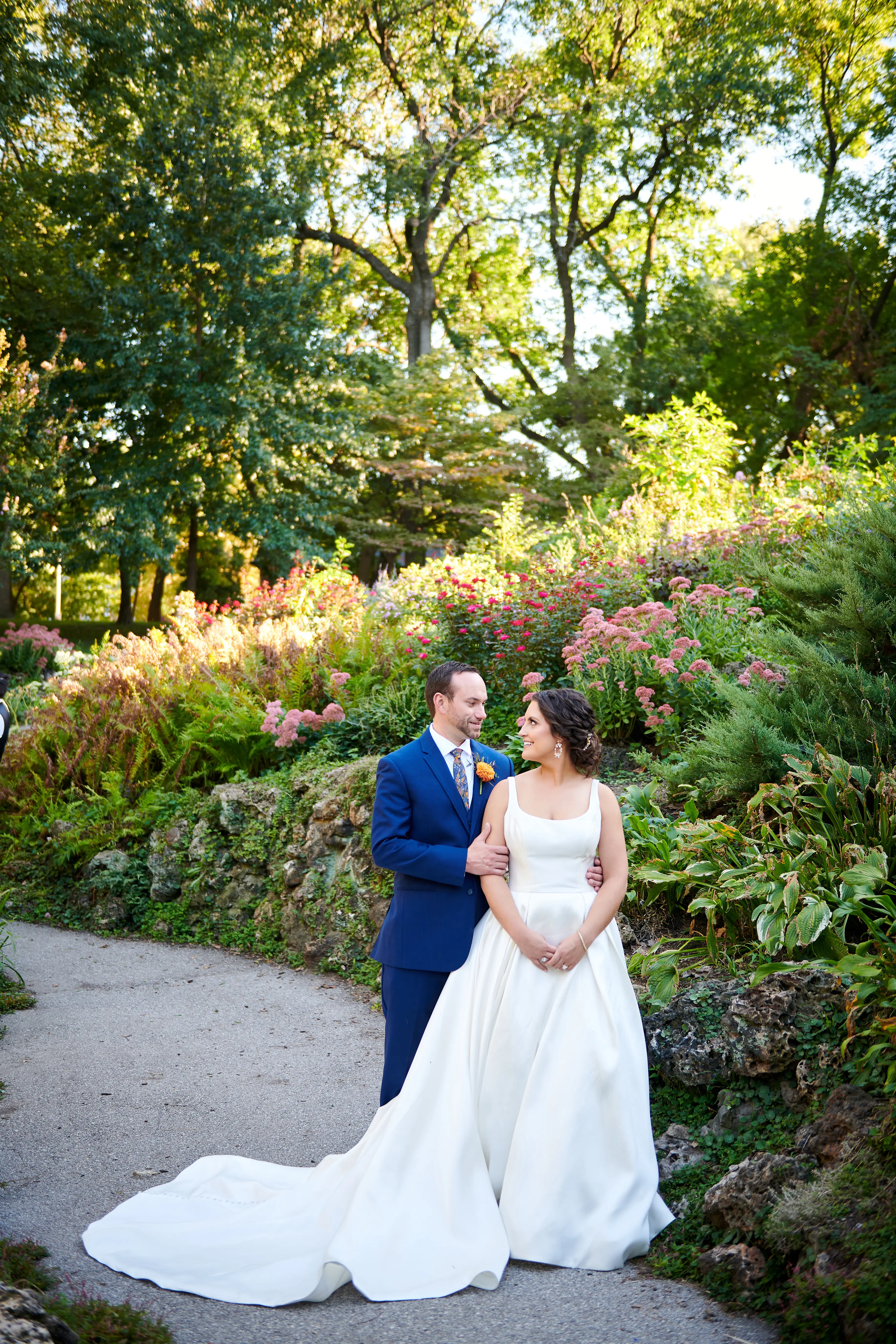 Bride Wearing Simple A-Line Bridal Gown Called Selena By Maggie Sottero With Groom In A Garden