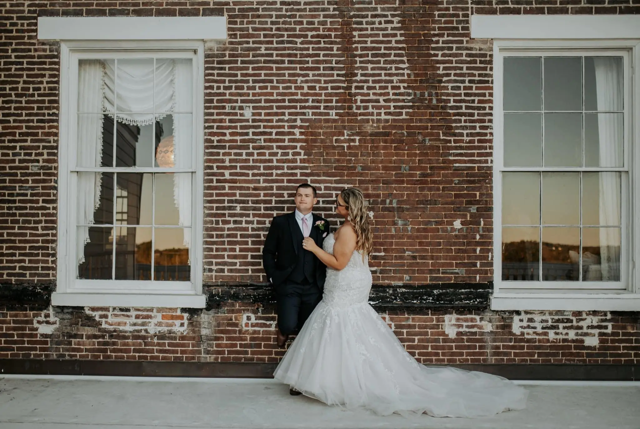 Bride wearing Danielle by Maggie Sottero with her husband