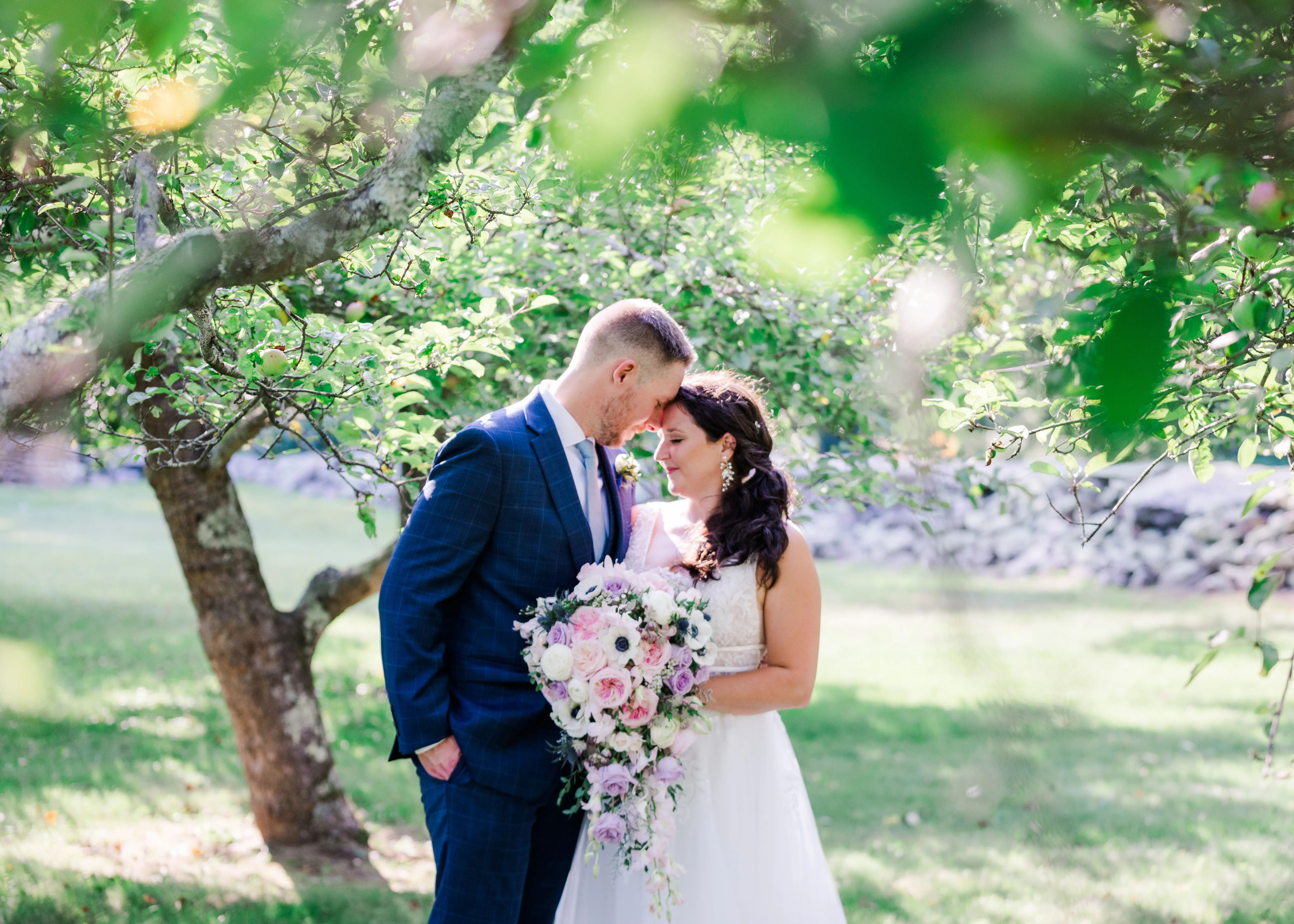 Groom With Bride Wearing Lace A-Line Wedding Dress Raelynn By Rebecca Ingram