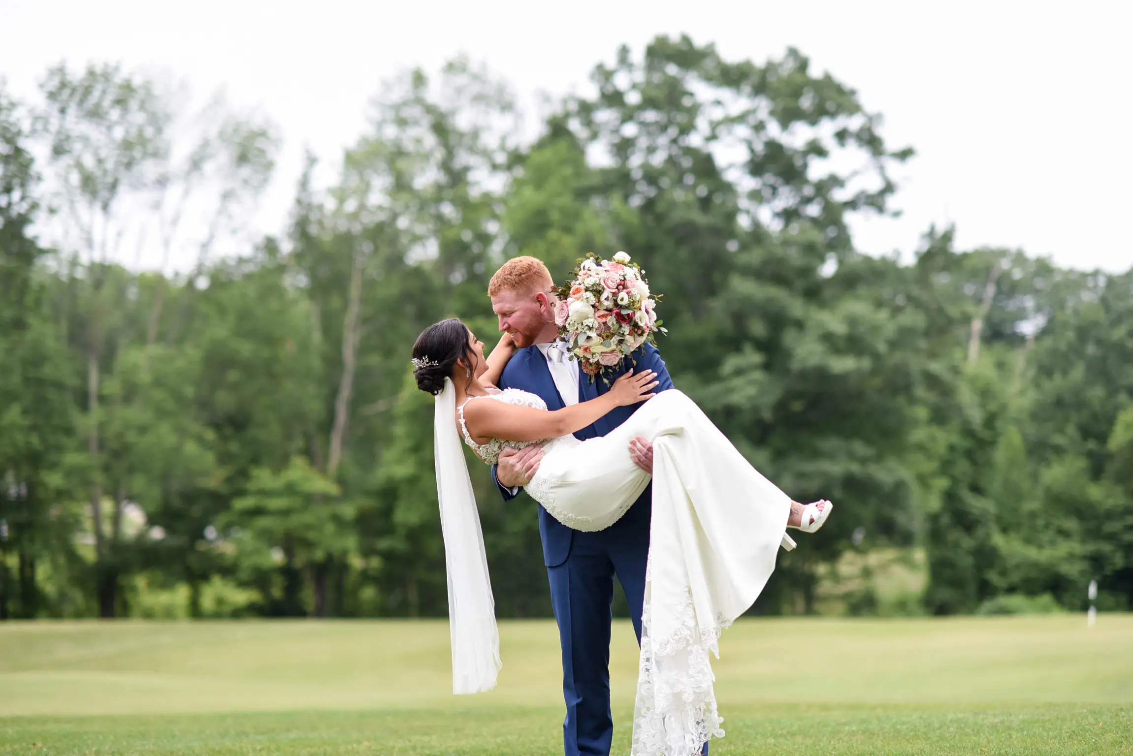 Bride with groom wearing crepe sheath wedding dress