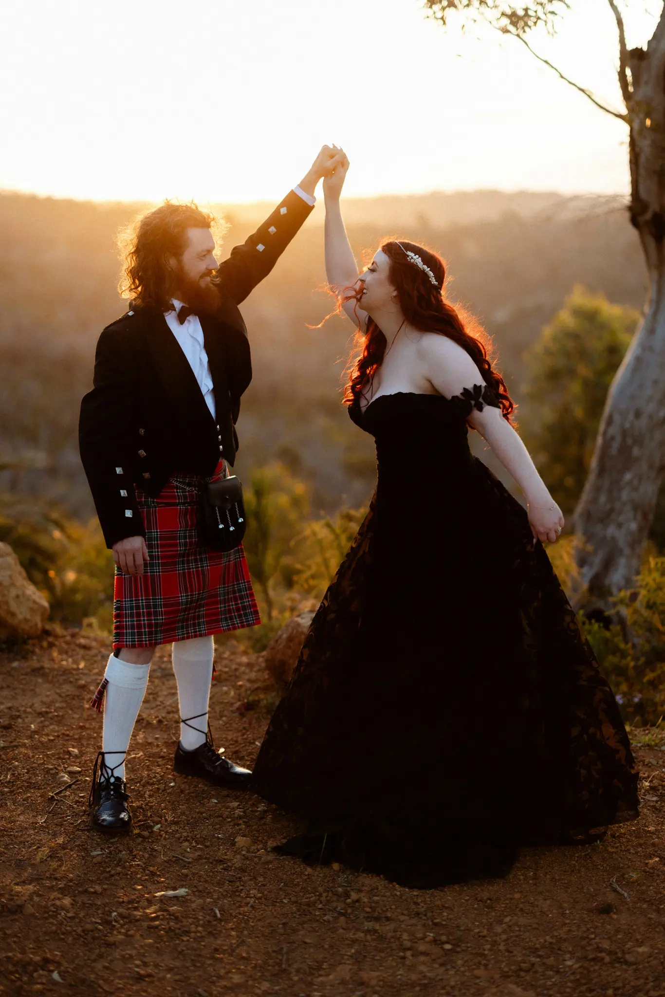 Bride Wearing Black Lace Wedding Dress Called Penny By Maggie Sottero Dancing With Groom Outside