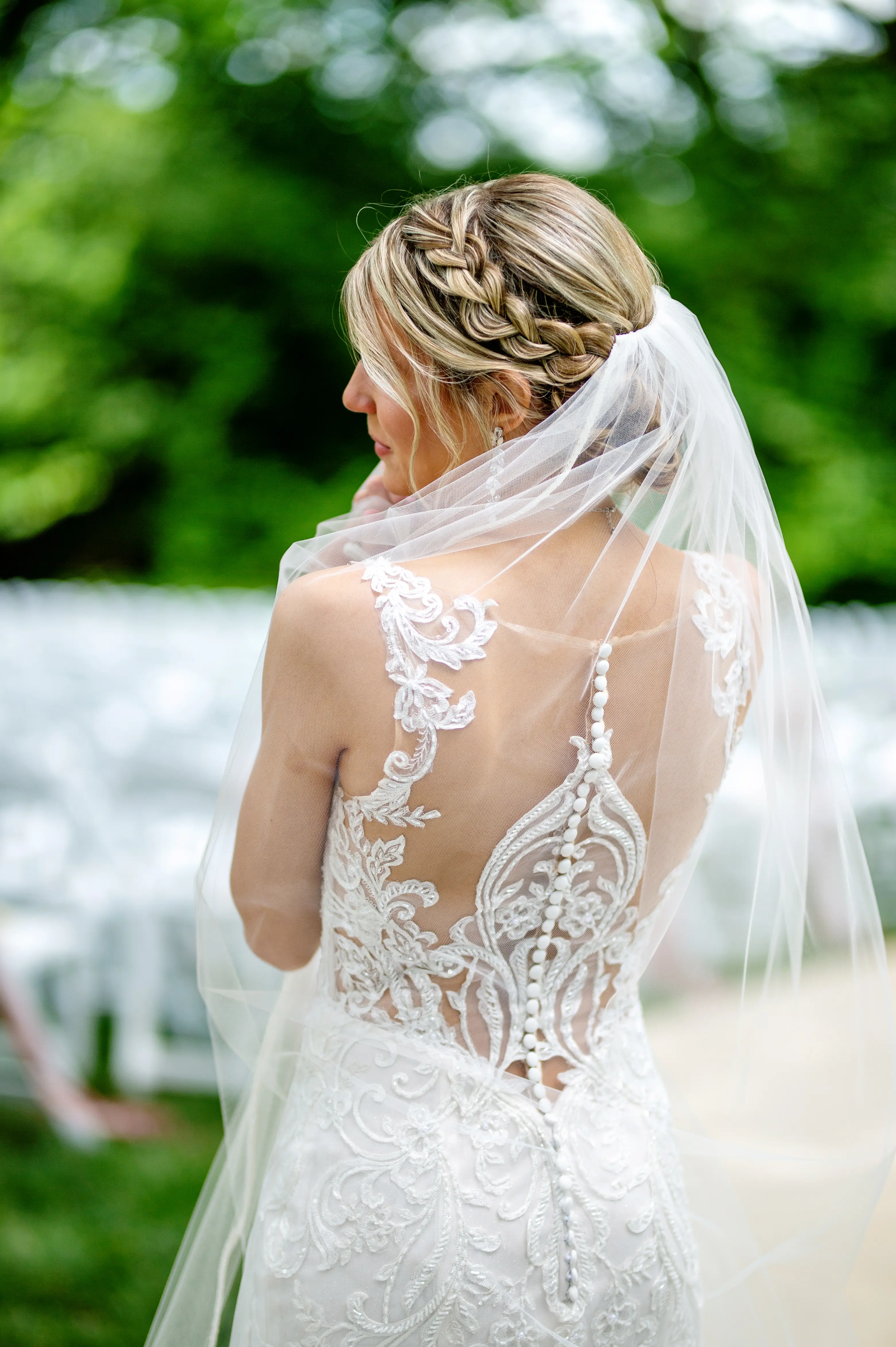Bride in Elegant Lace Sheath Wedding Dress with Beaded Lace Motifs over Textured Tulle Called Hamilton by Sottero & Midgley
