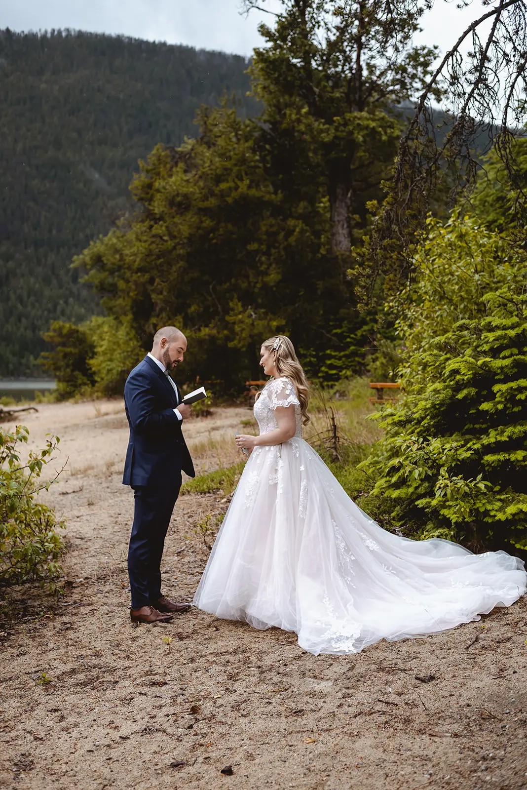 Bride Wearing Lace Aline Wedding Dress Called Harlem By Maggie Sottero With Groom Reading His Vows